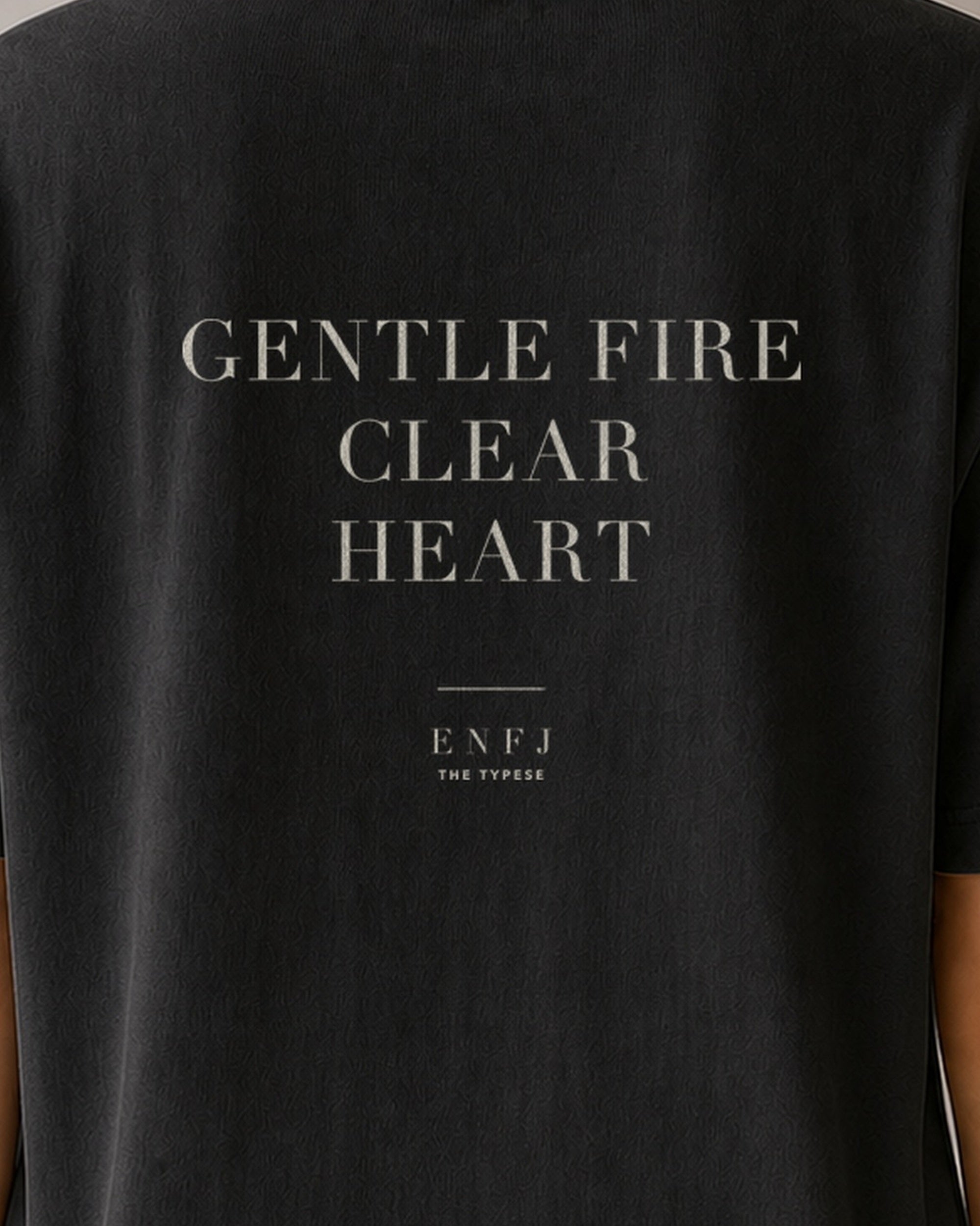 The Typese ENFJ Comfort Colors Tee in black, female back detail