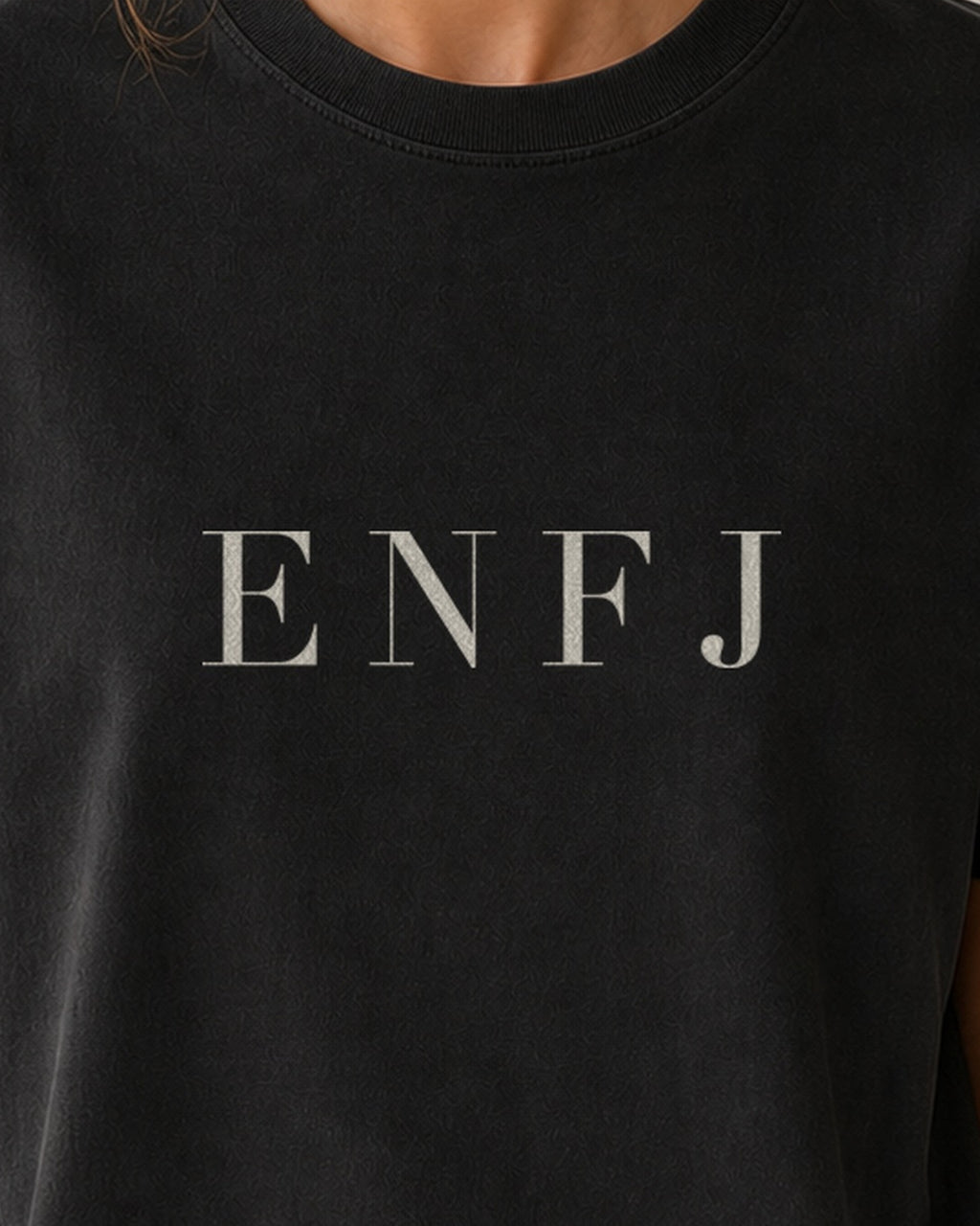 The Typese ENFJ Comfort Colors Tee in black, female front detail
