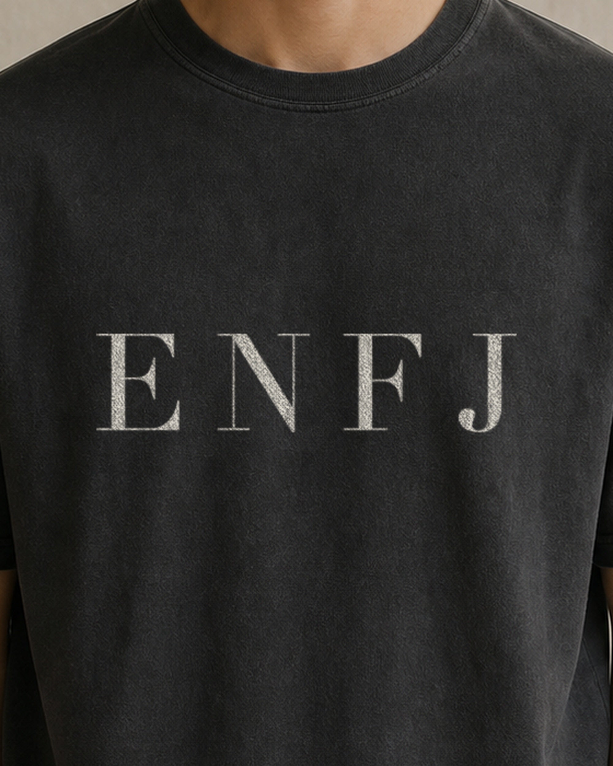 The Typese ENFJ Comfort Colors Tee in black, male front detail