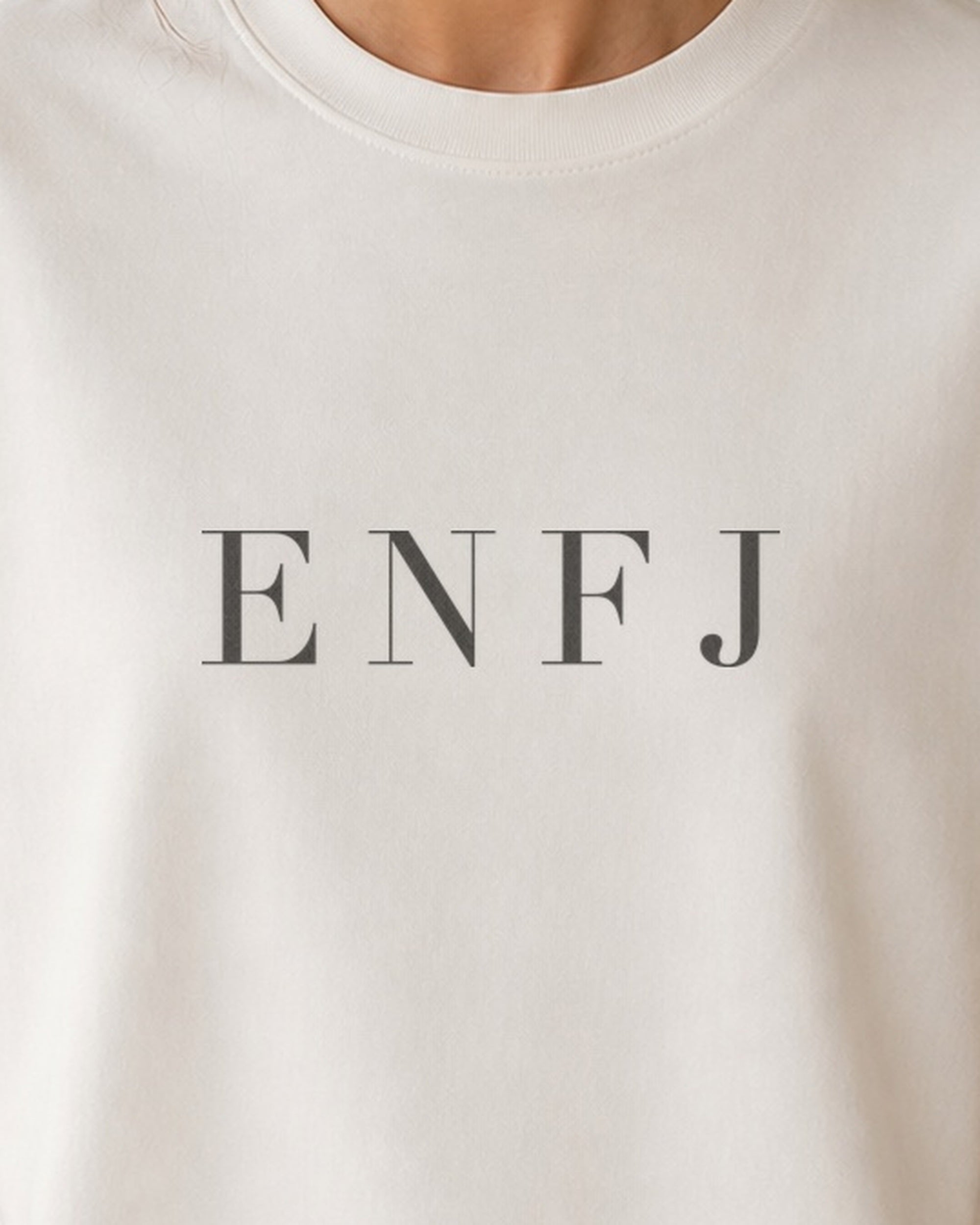 The Typese ENFJ Comfort Colors Tee in cream white, female front detail