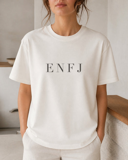 The Typese ENFJ Comfort Colors Tee in cream white, female front