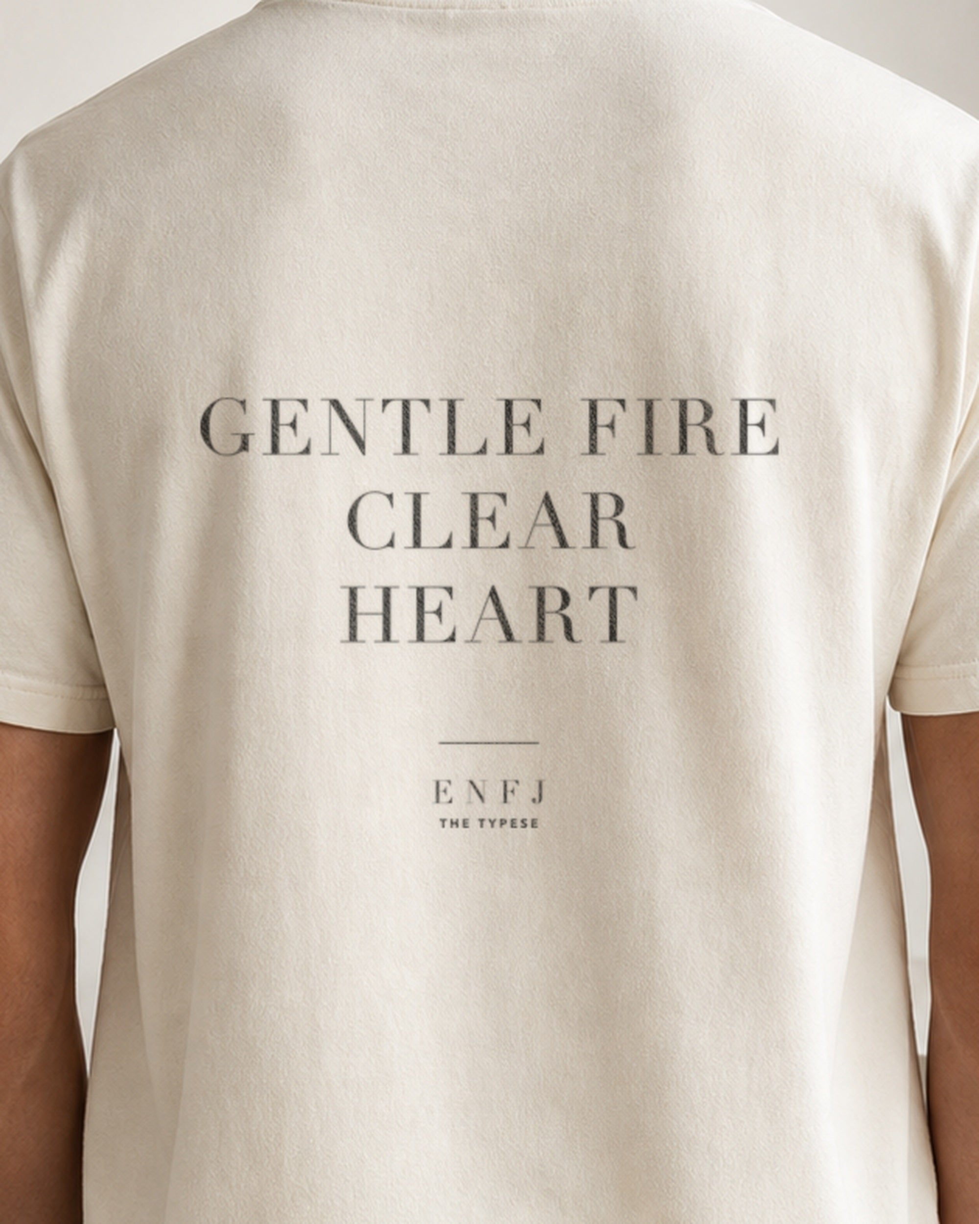 The Typese ENFJ Comfort Colors Tee in cream white, male back detail