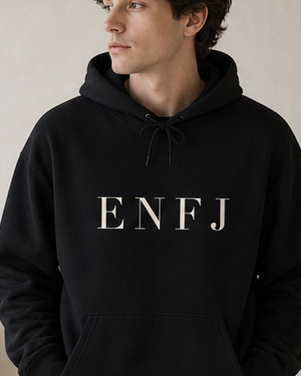 The Typese ENFJ Gildan hoodie in black, male front detail
