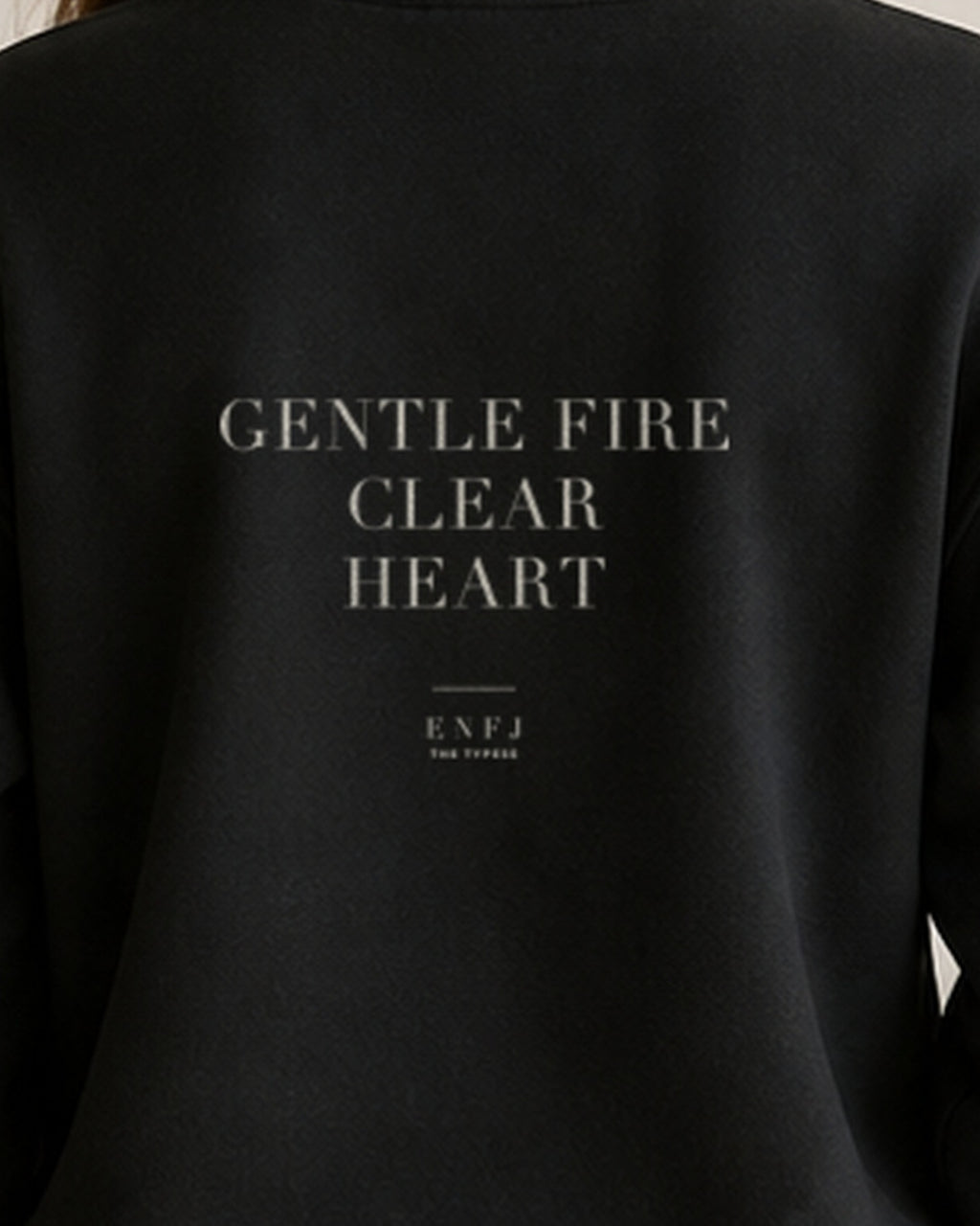 The Typese ENFJ Gildan crewneck sweatshirt in black, female back print close