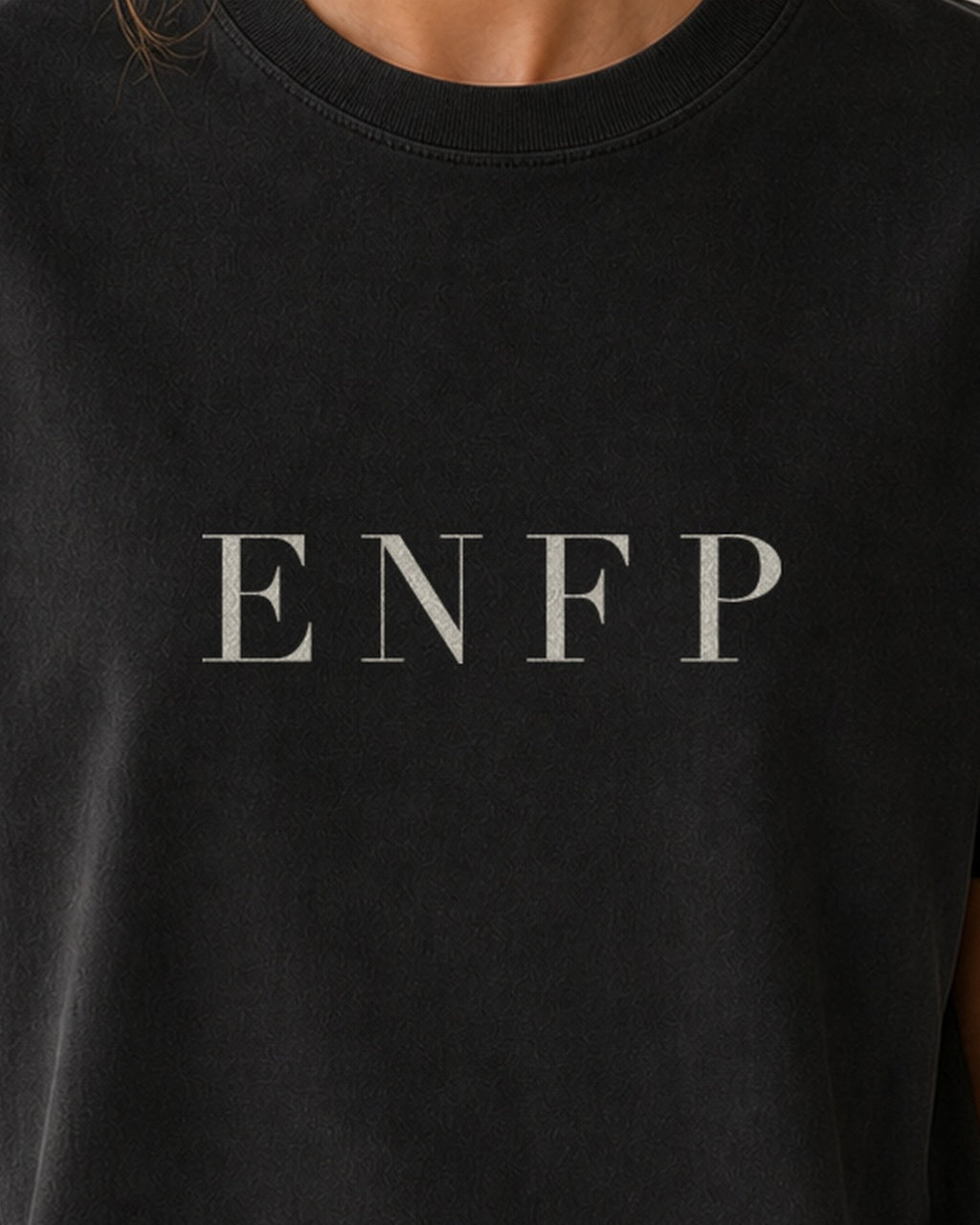 The Typese ENFP Comfort Colors Tee in black, female front detail