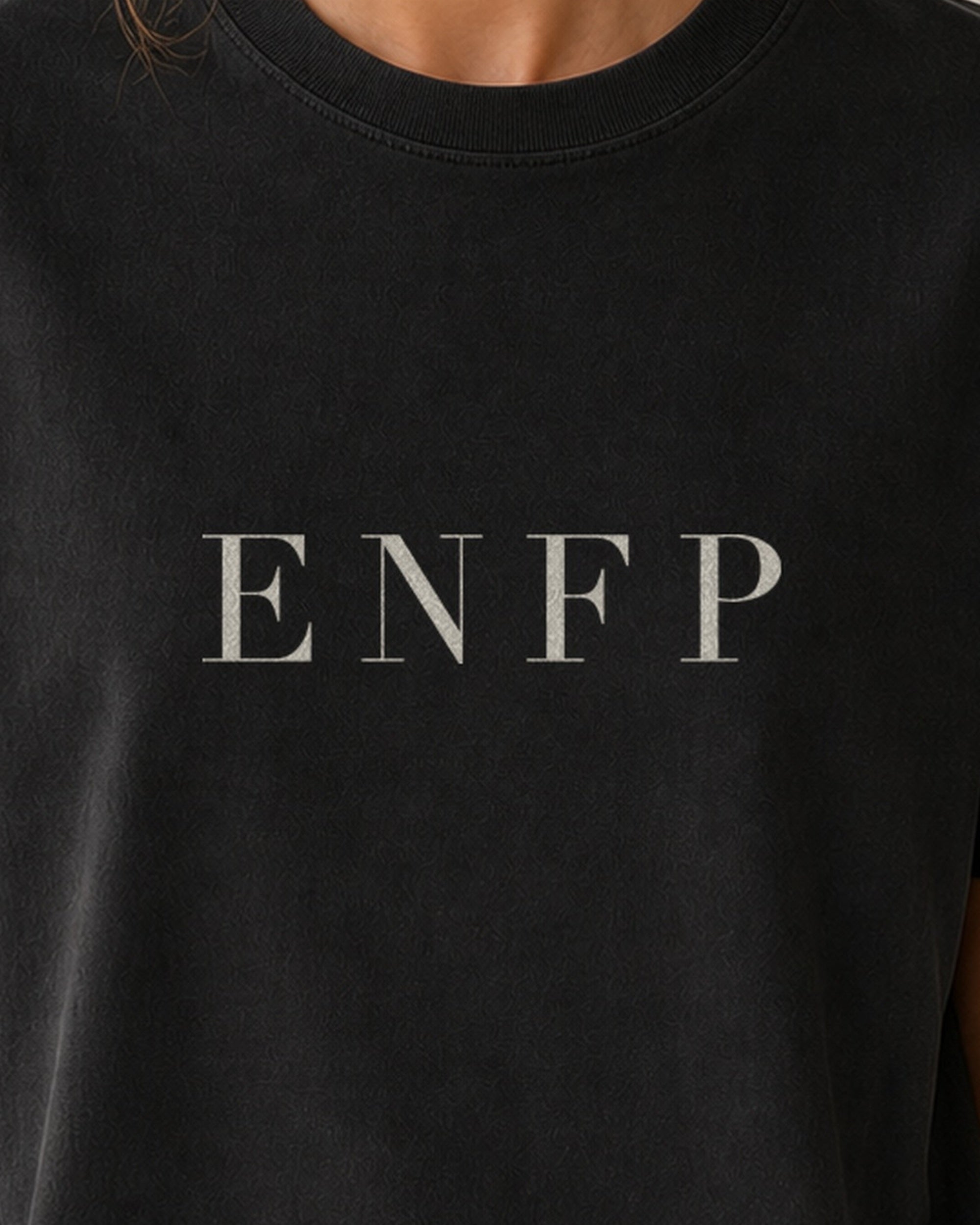 The Typese ENFP Comfort Colors Tee in black, female front detail