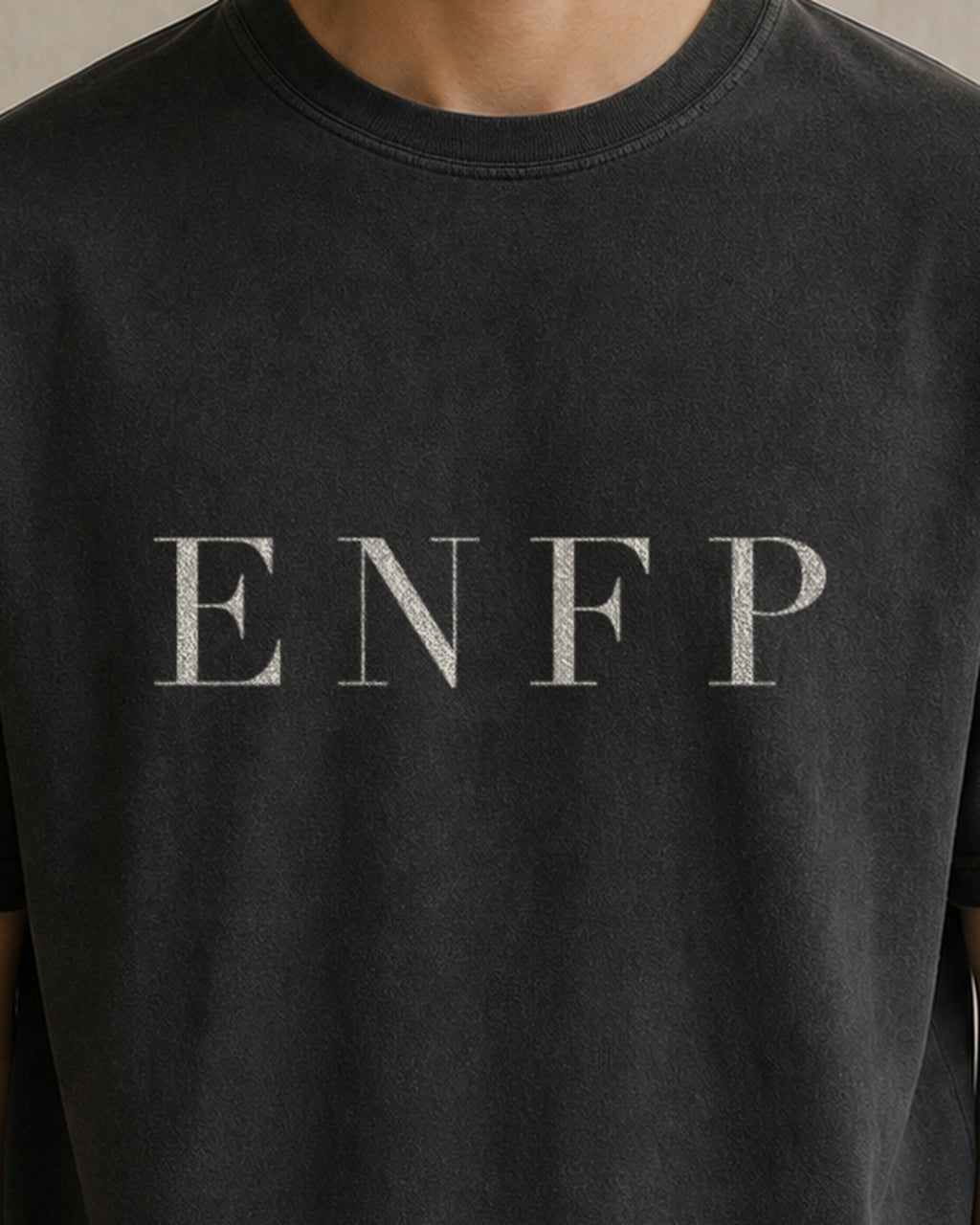 The Typese ENFP Comfort Colors Tee in black, male front detail