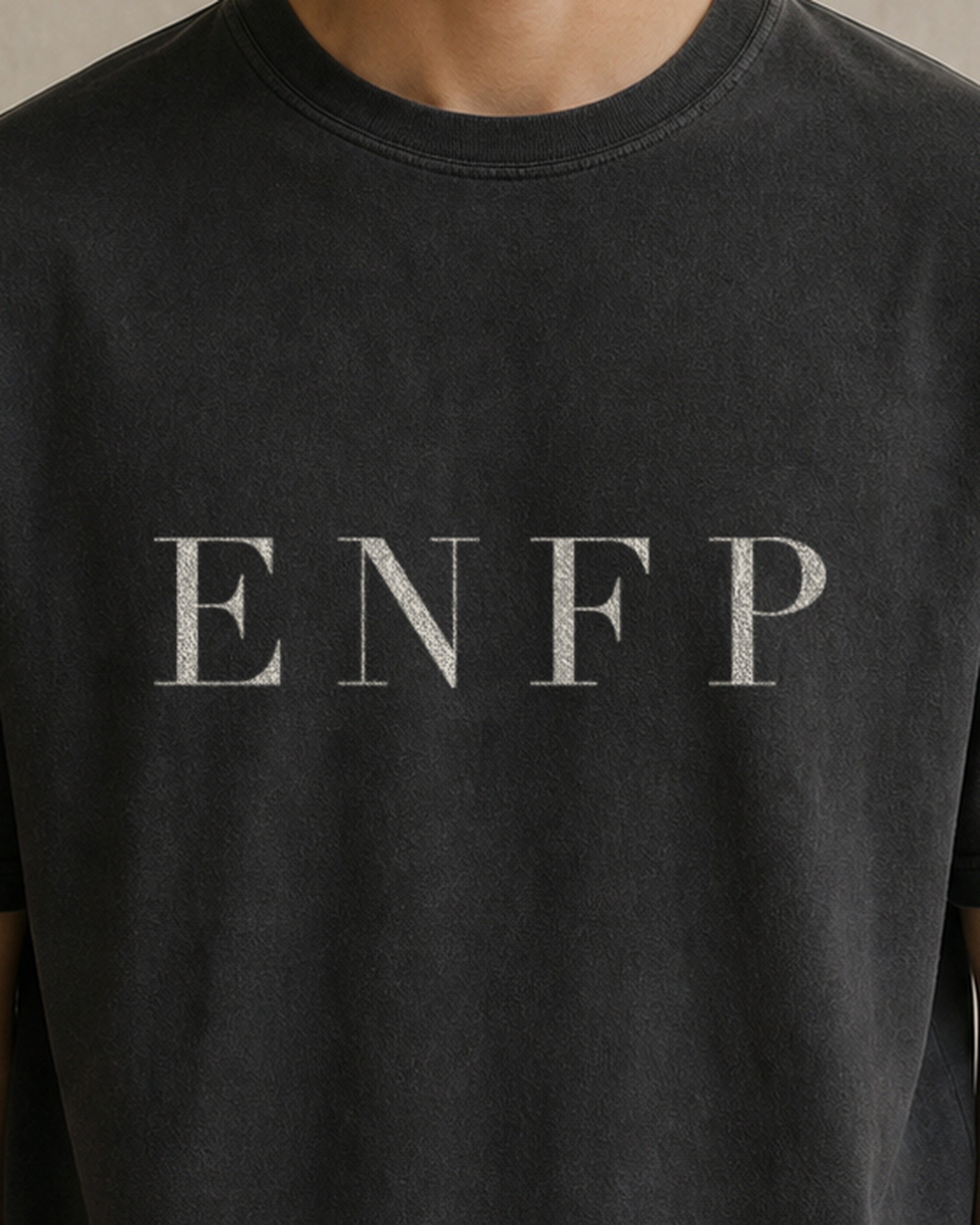 The Typese ENFP Comfort Colors Tee in black, male front detail