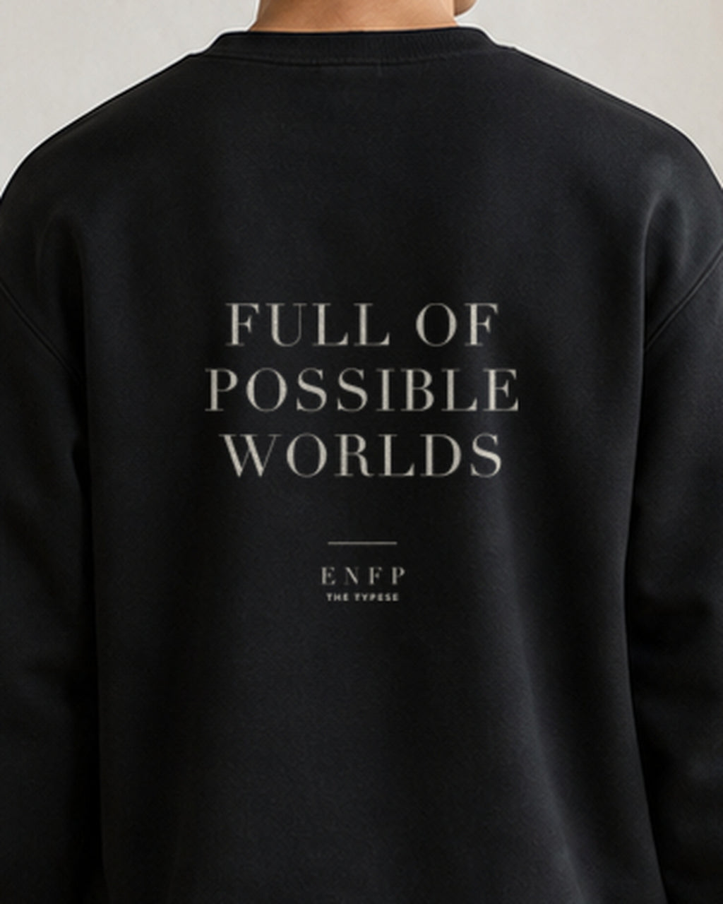 The Typese ENFP Gildan crewneck sweatshirt in black, male back detail