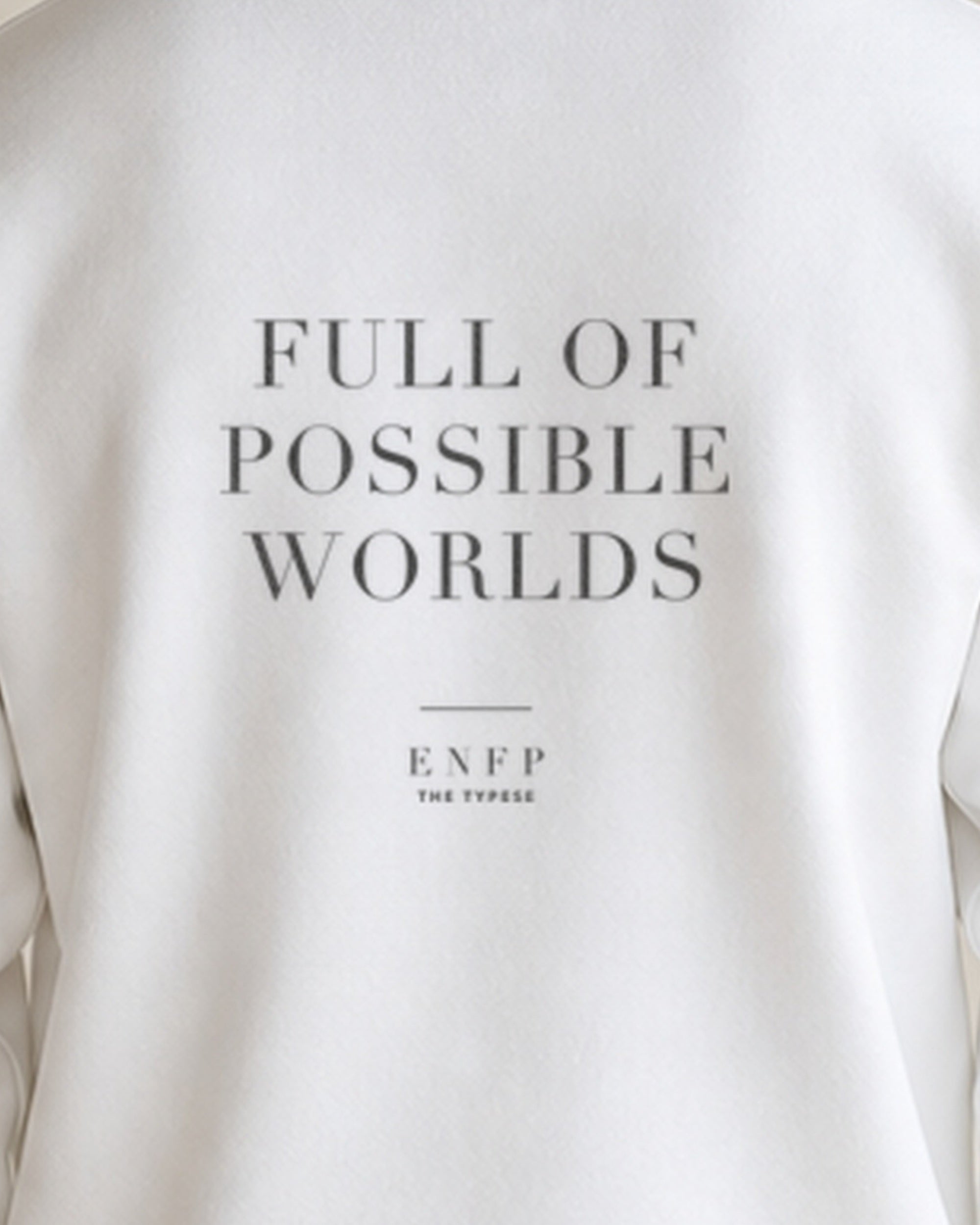 The Typese ENFP Gildan crewneck sweatshirt in white, male back print close