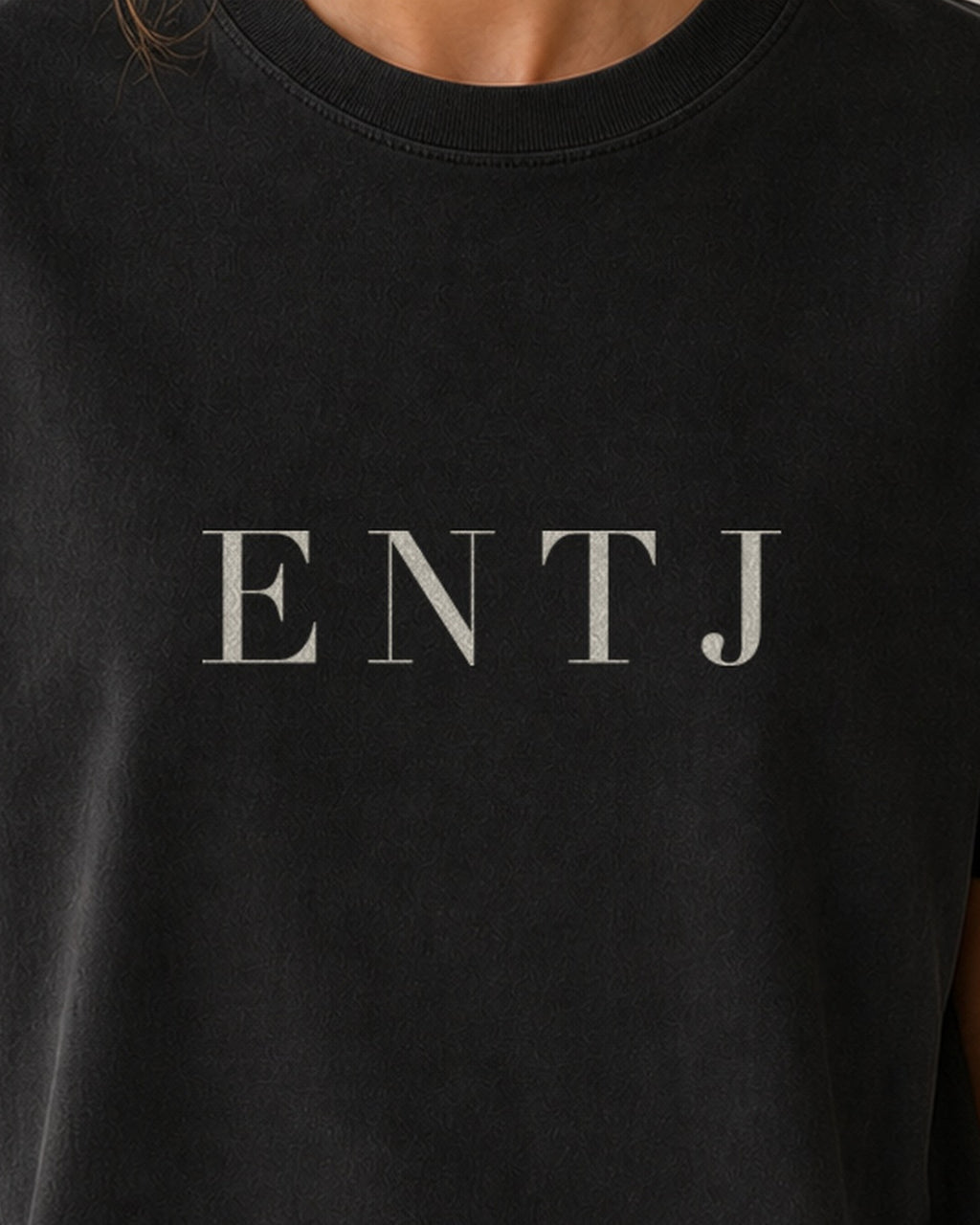 The Typese ENTJ Comfort Colors Tee in black, female front detail