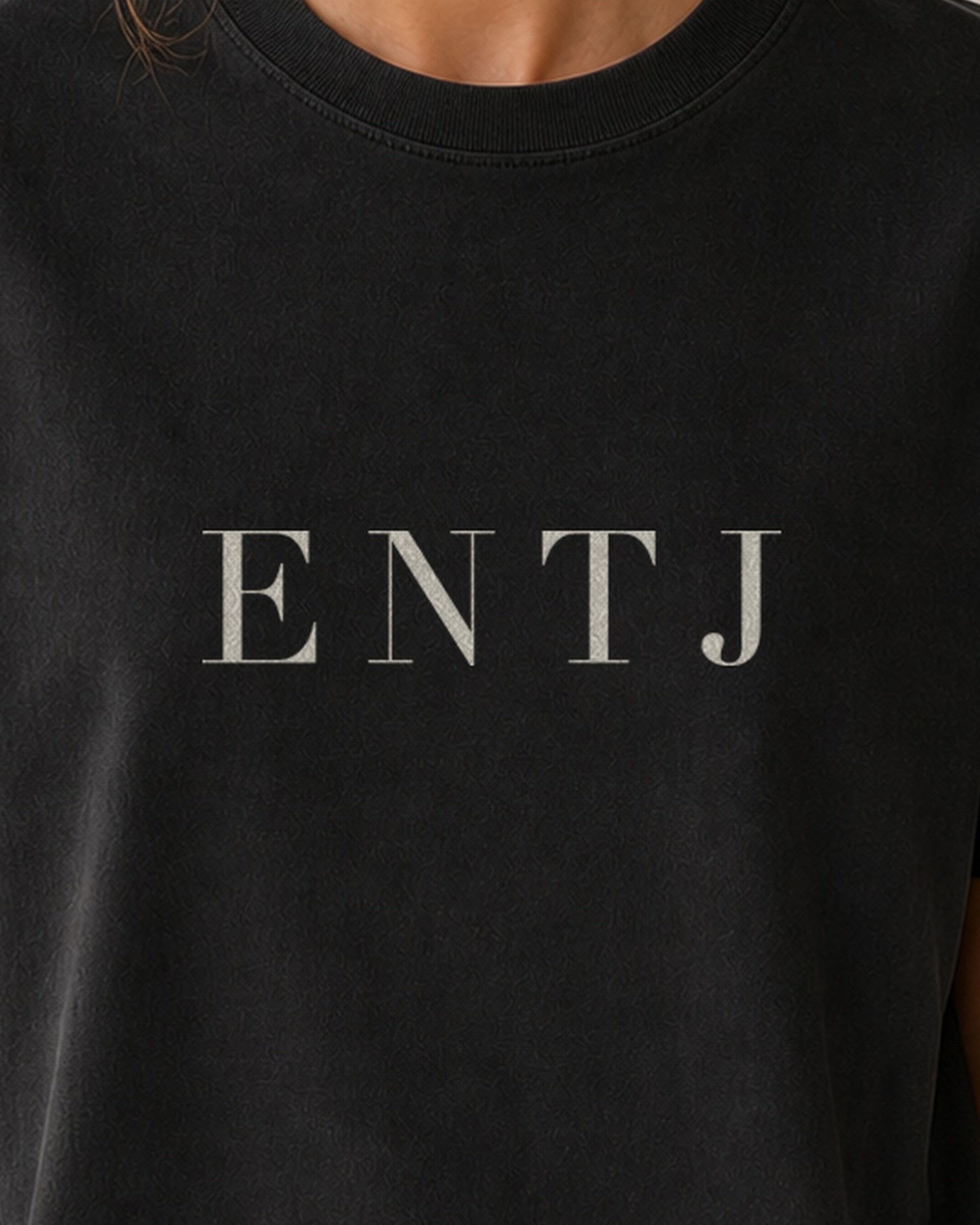 The Typese ENTJ Comfort Colors Tee in black, female front detail