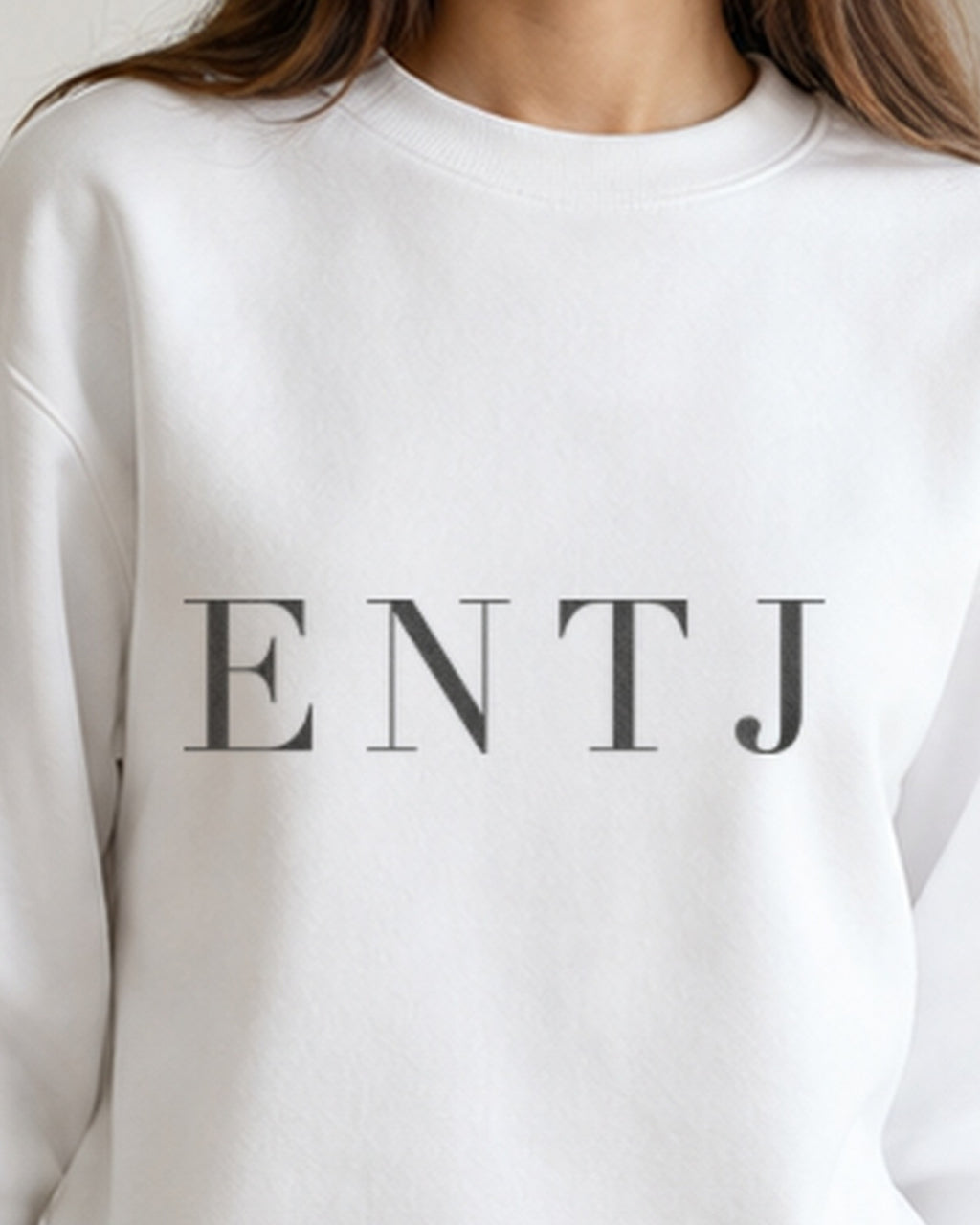 The Typese ENTJ Gildan crewneck sweatshirt in white, female front neckline fabric