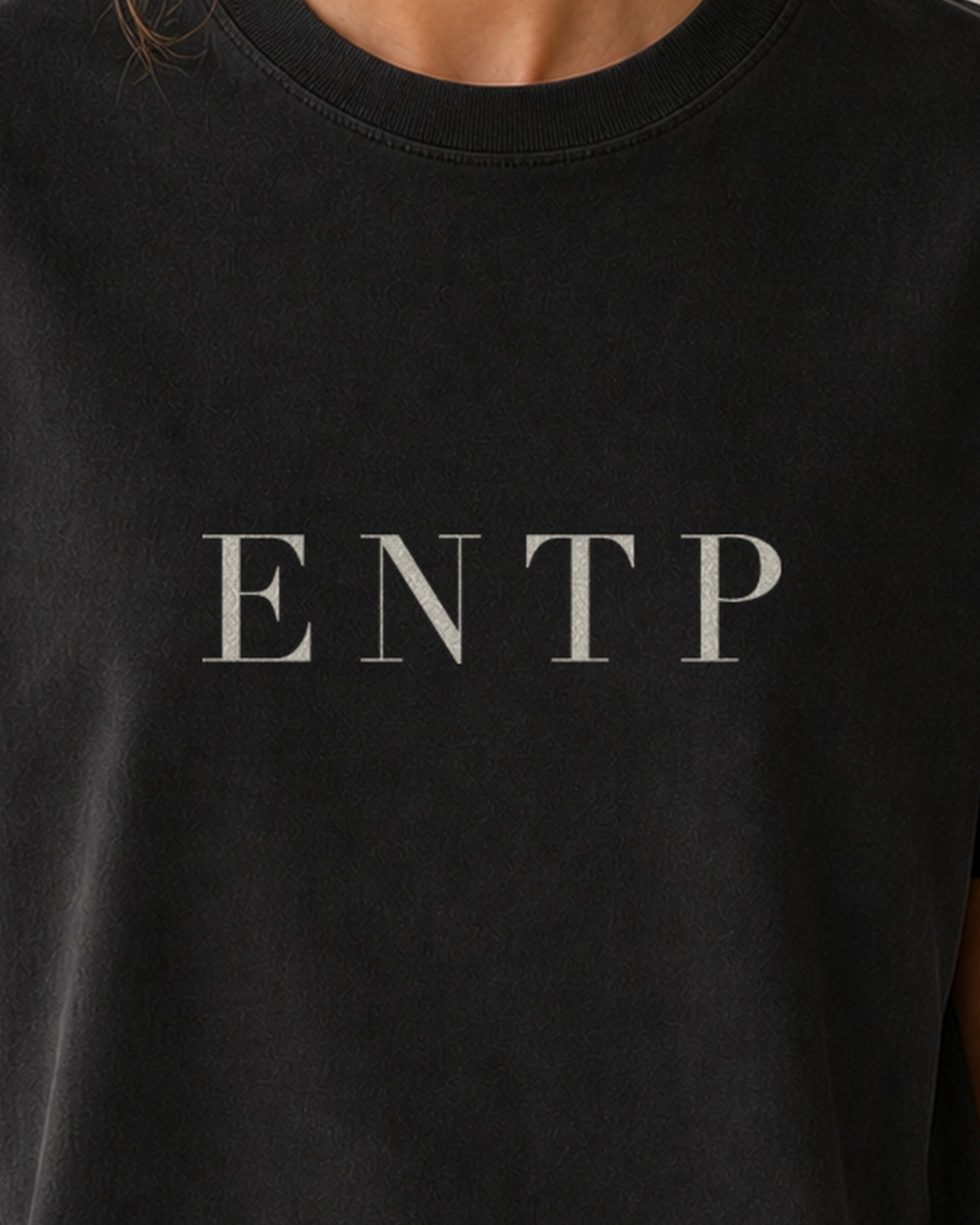 The Typese ENTP Comfort Colors Tee in black, female front detail