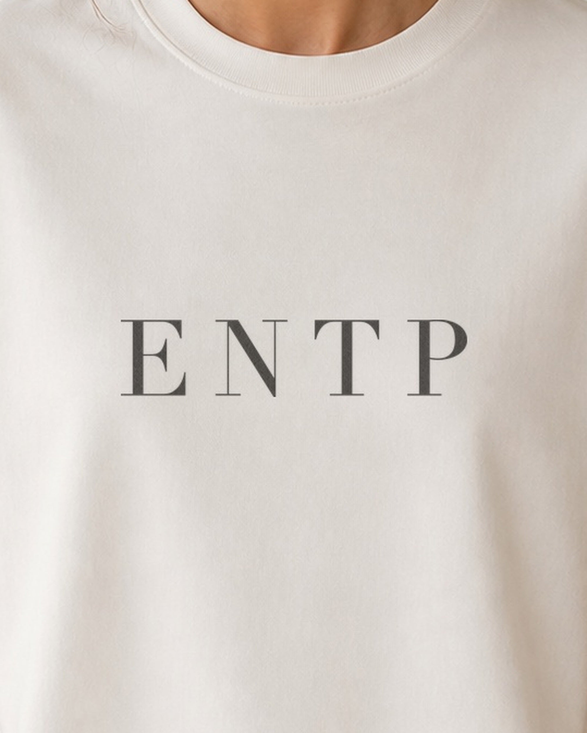 The Typese ENTP Comfort Colors Tee in cream white, female front detail