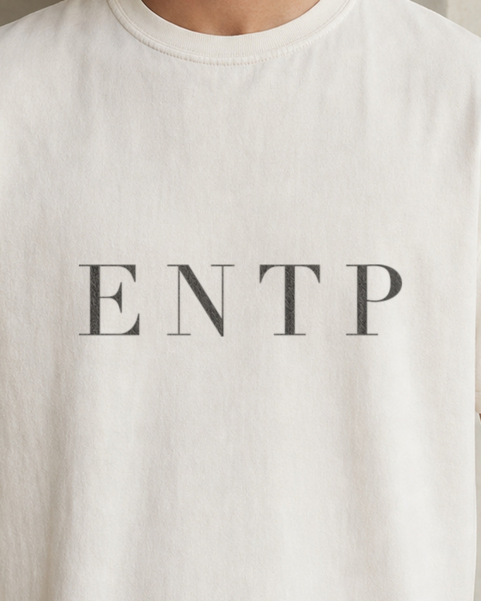 The Typese ENTP Comfort Colors Tee in cream white, male front detail