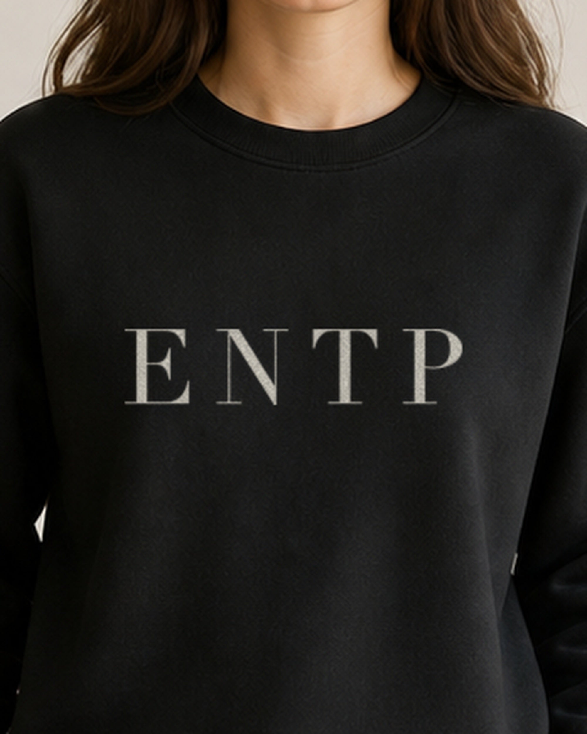 The Typese ENTP Gildan crewneck sweatshirt in black, female front detail