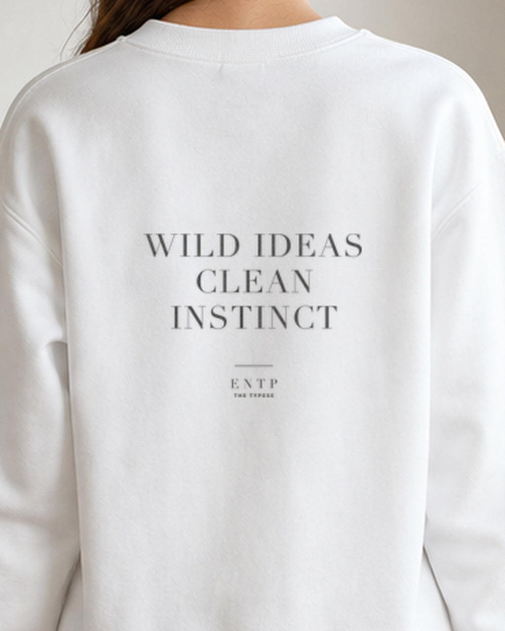 The Typese ENTP Gildan crewneck sweatshirt in white, female back detail