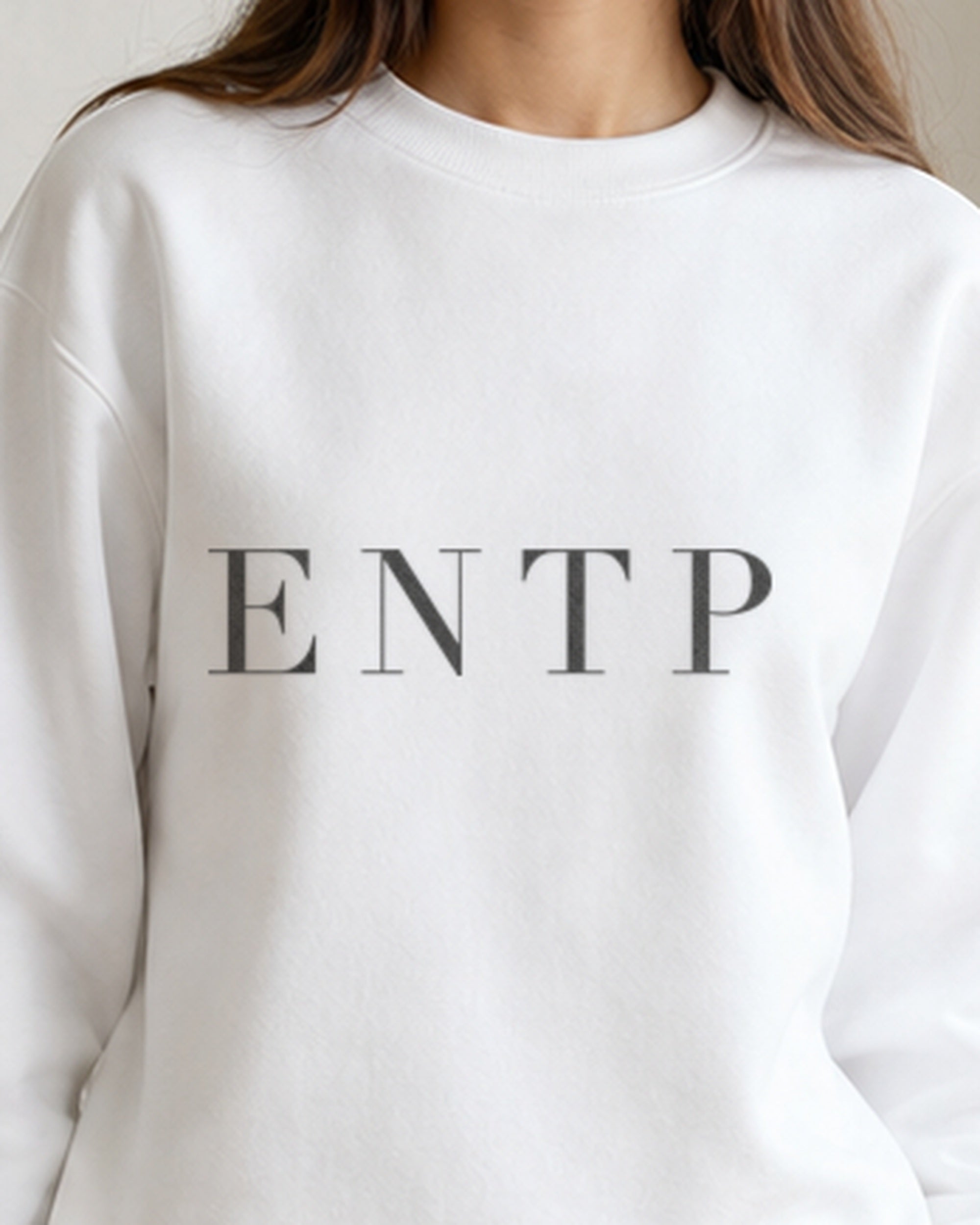 The Typese ENTP Gildan crewneck sweatshirt in white, female front detail