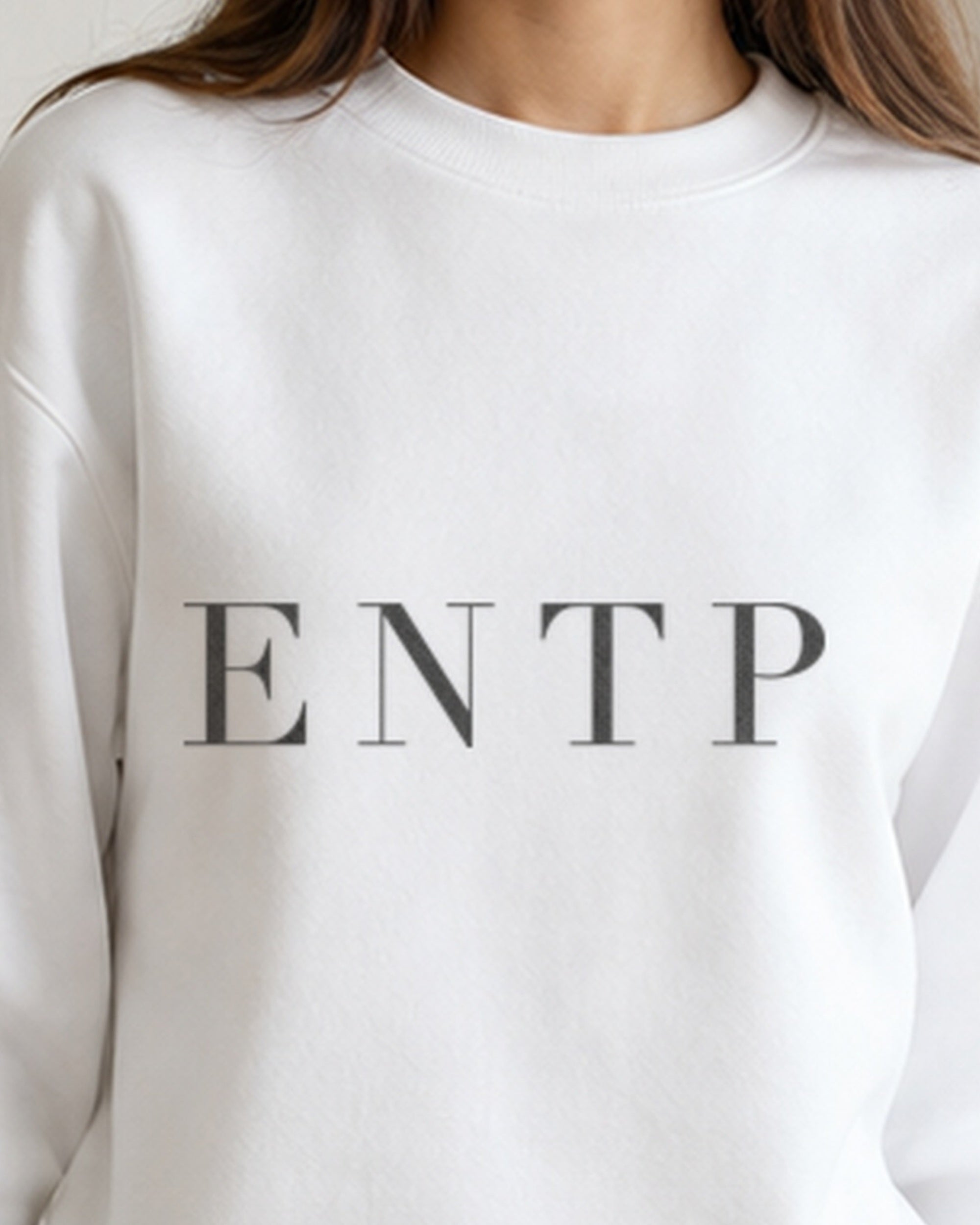 The Typese ENTP Gildan crewneck sweatshirt in white, female front neckline fabric