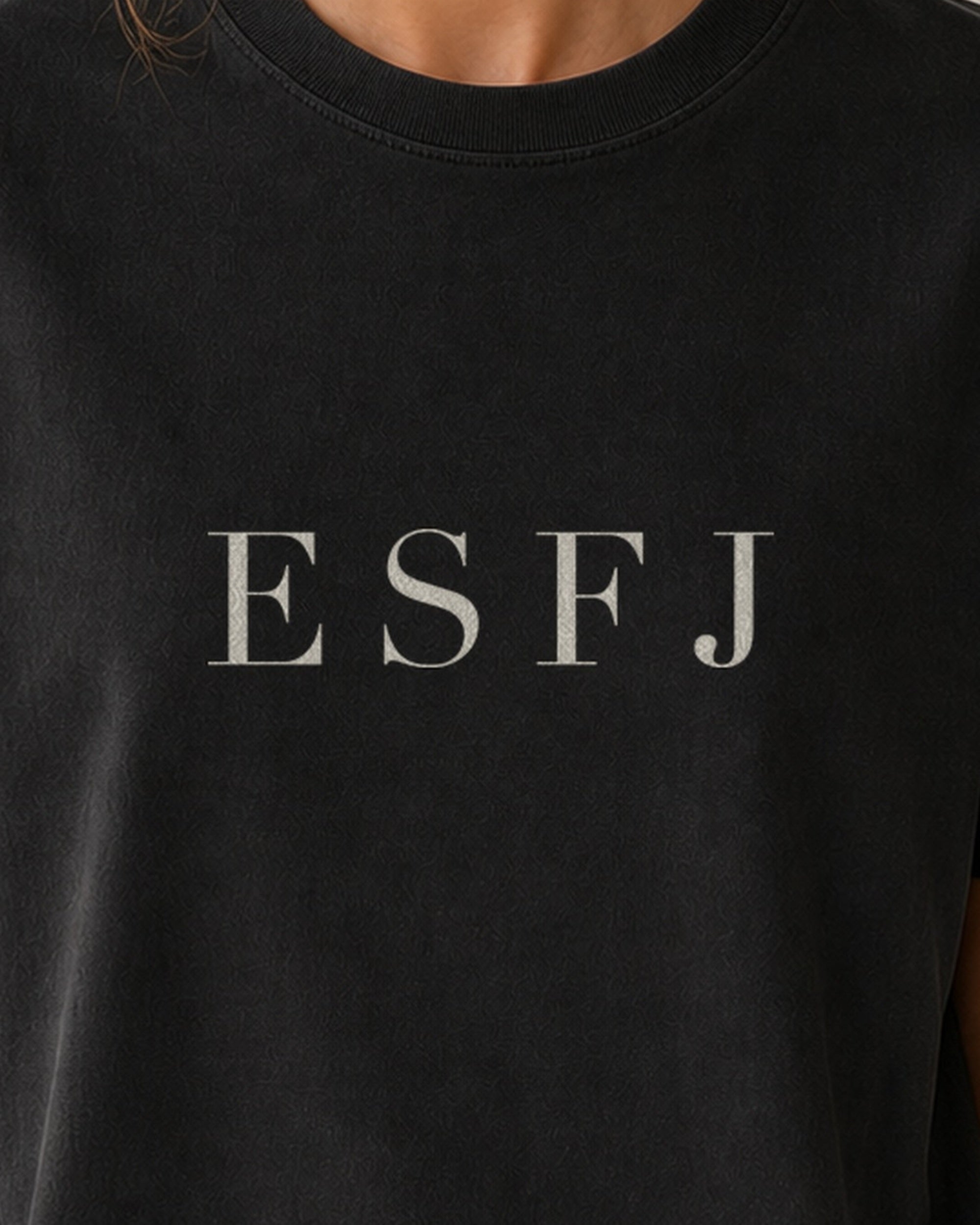 The Typese ESFJ Comfort Colors Tee in black, female front detail