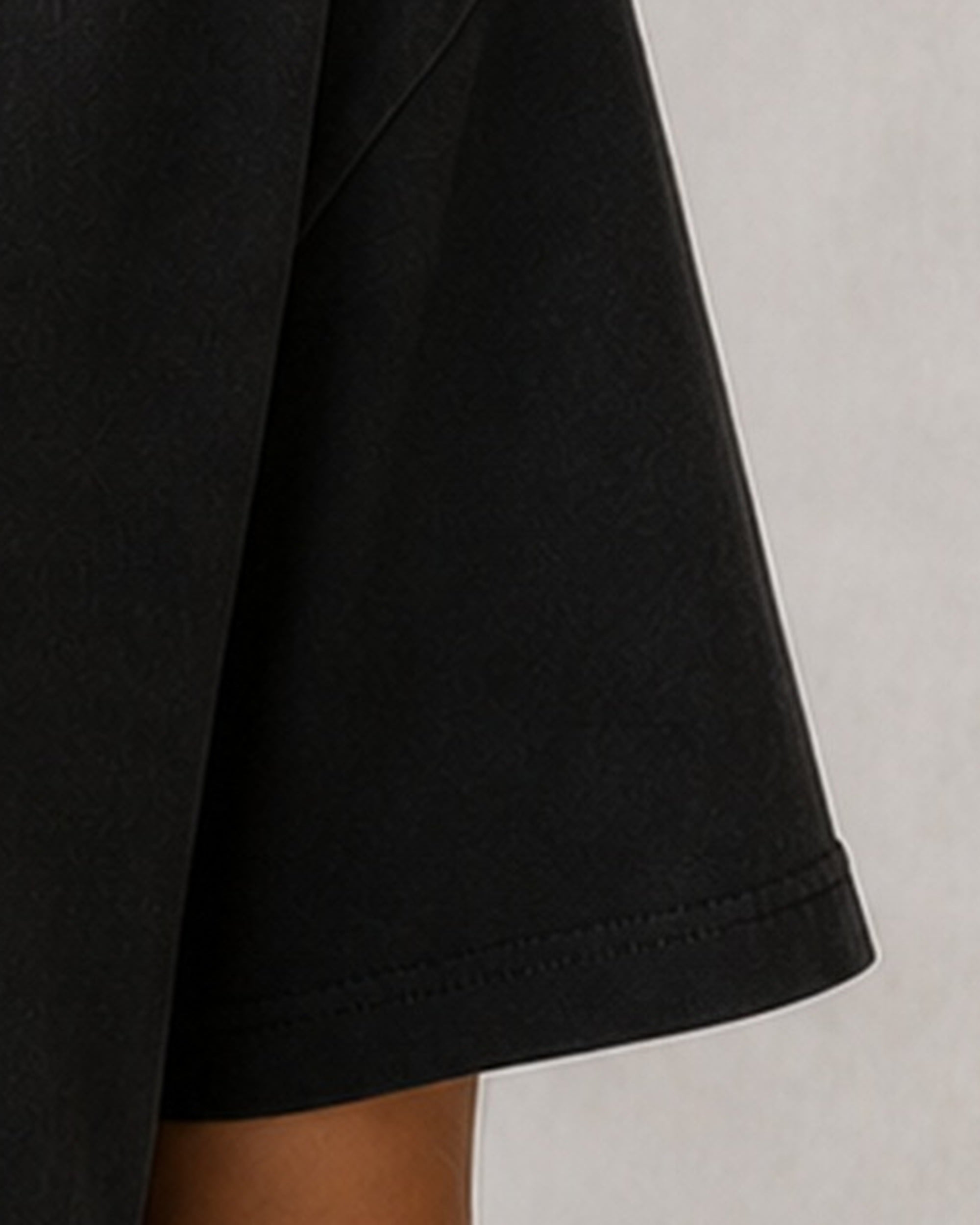 The Typese ESFJ Comfort Colors Tee in black, female sleeve detail