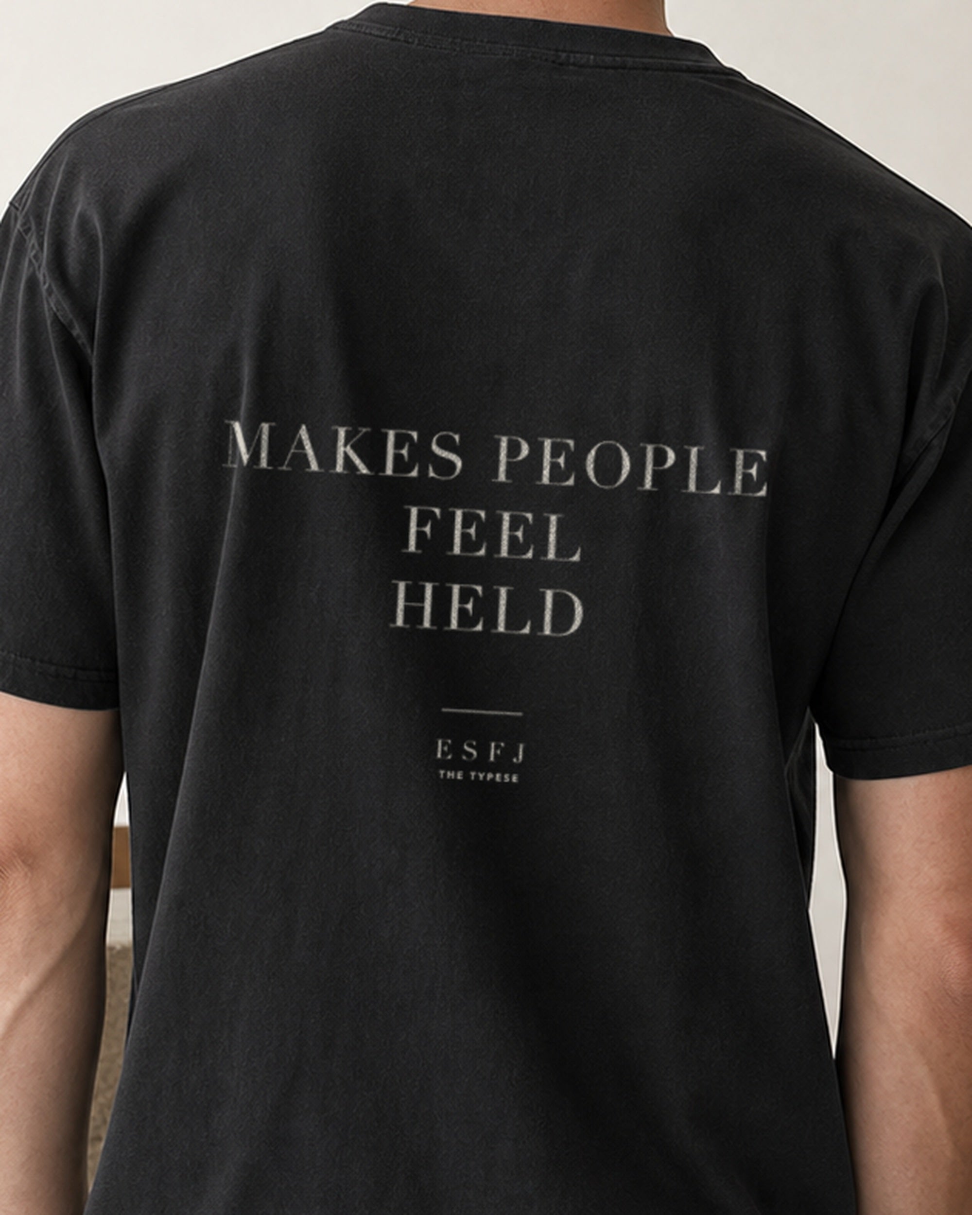 The Typese ESFJ Comfort Colors Tee in black, male back detail