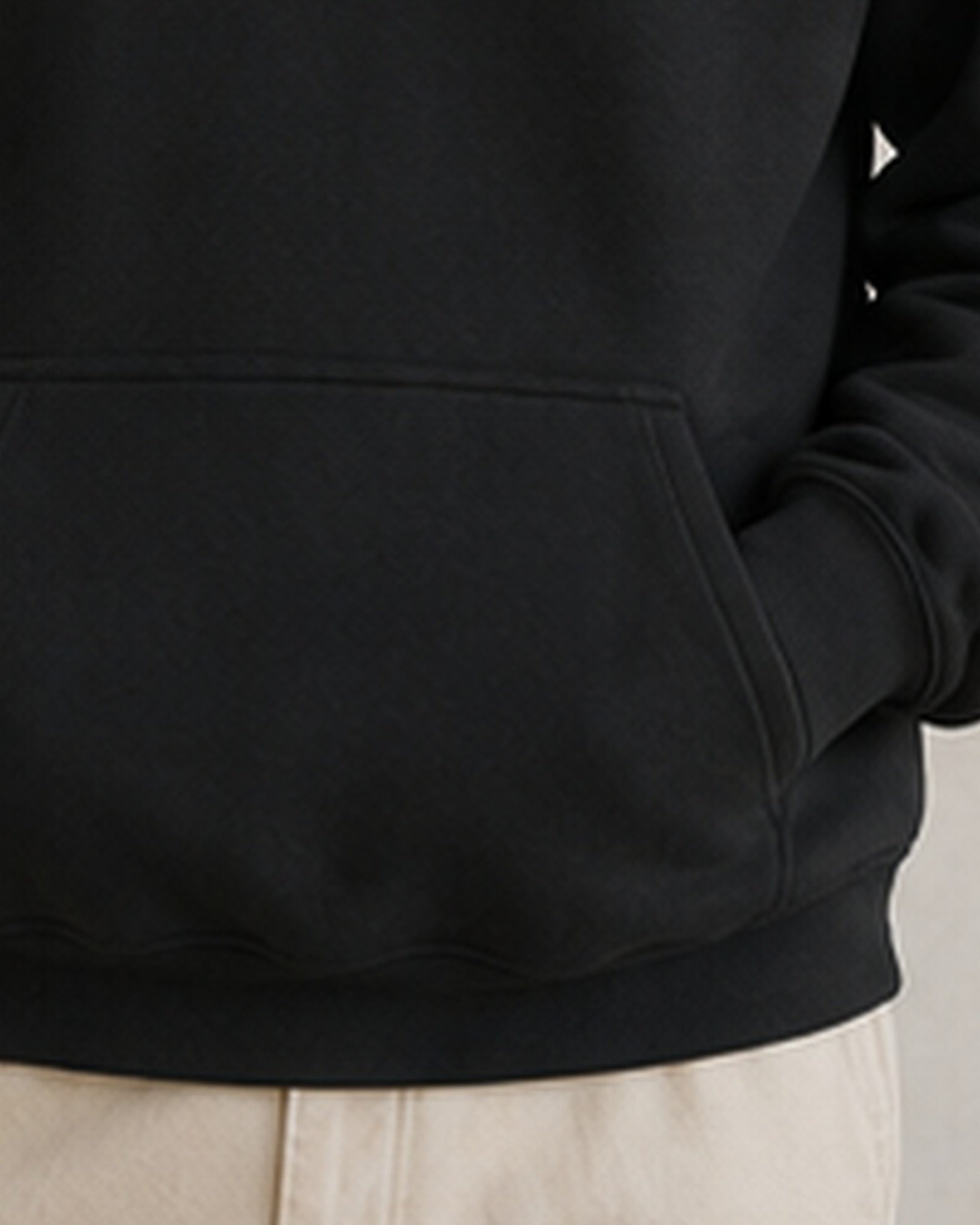 The Typese ESFJ Gildan hoodie in black, hem pocket detail