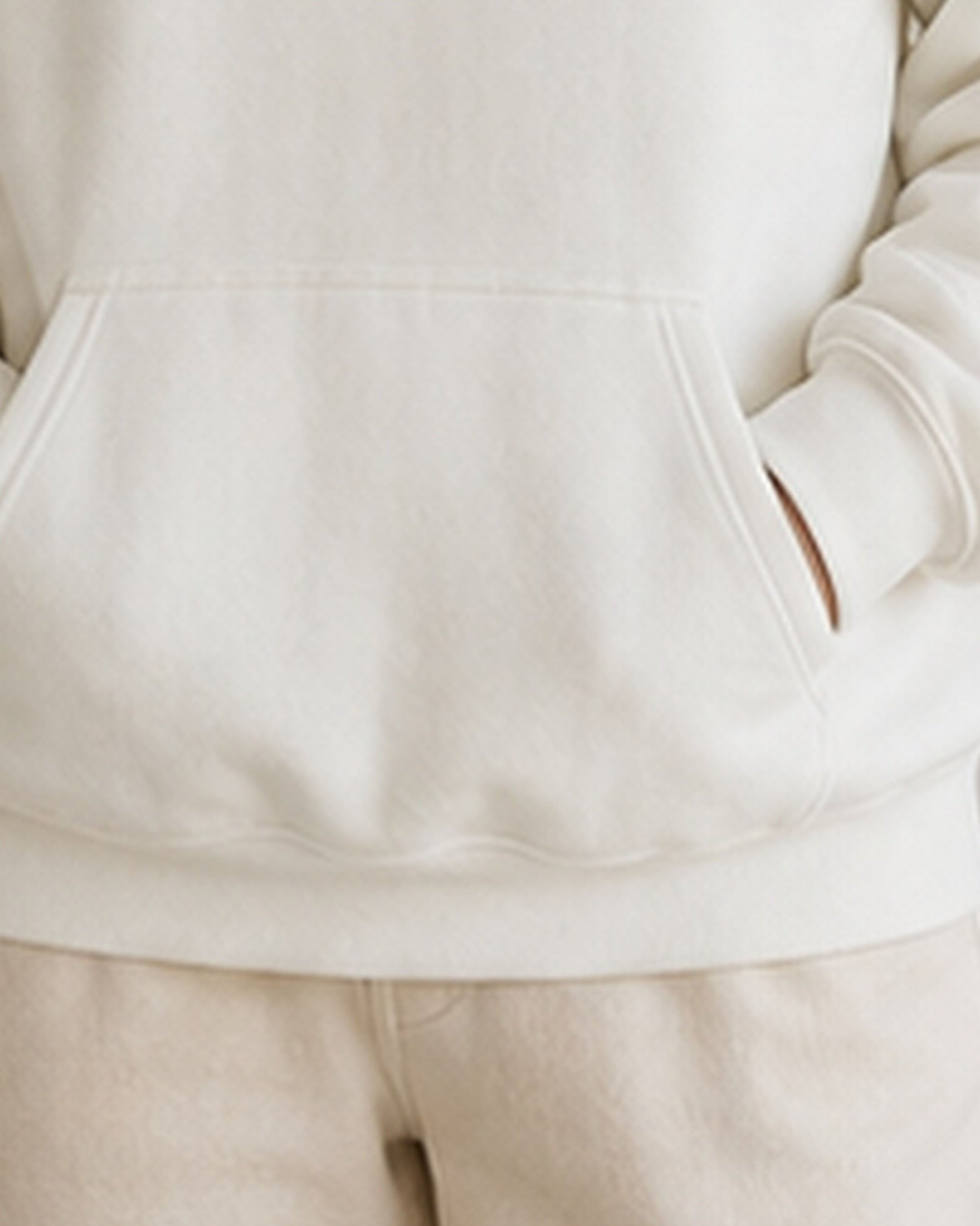 The Typese ESFJ Gildan hoodie in white, hem pocket detail