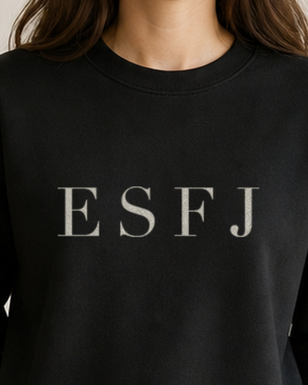 The Typese ESFJ Gildan crewneck sweatshirt in black, female front neckline fabric