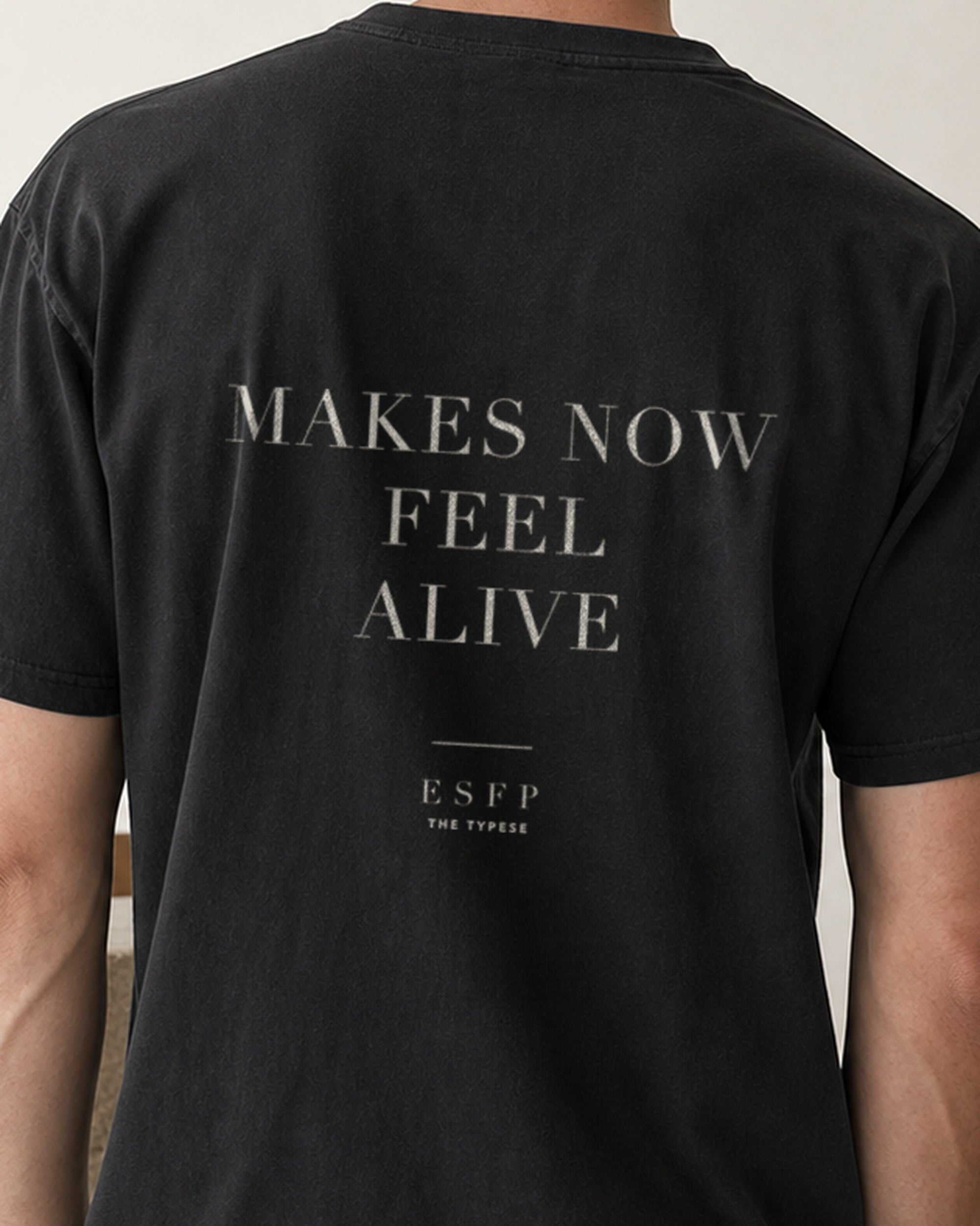 The Typese ESFP Comfort Colors Tee in black, male back detail