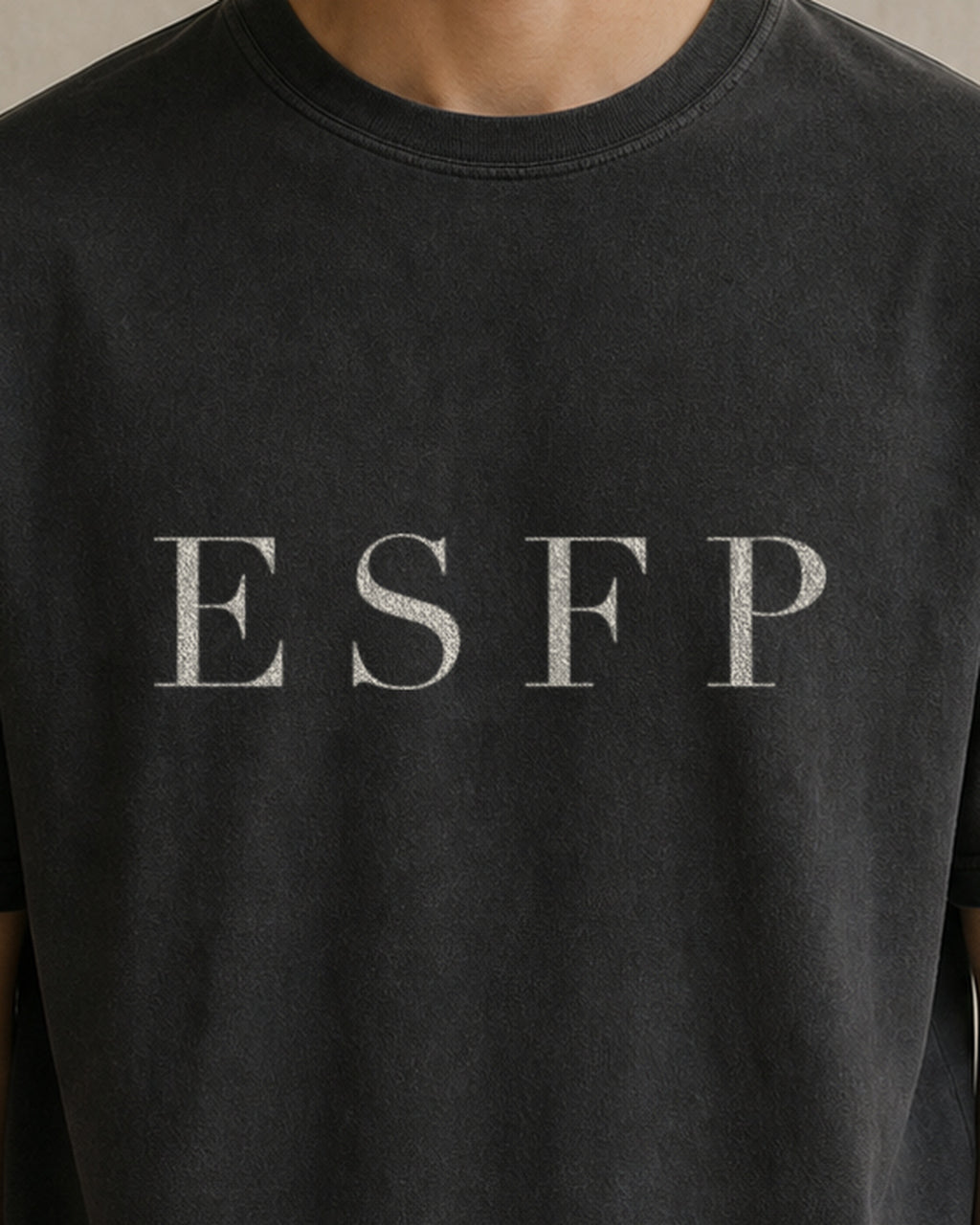The Typese ESFP Comfort Colors Tee in black, male front detail
