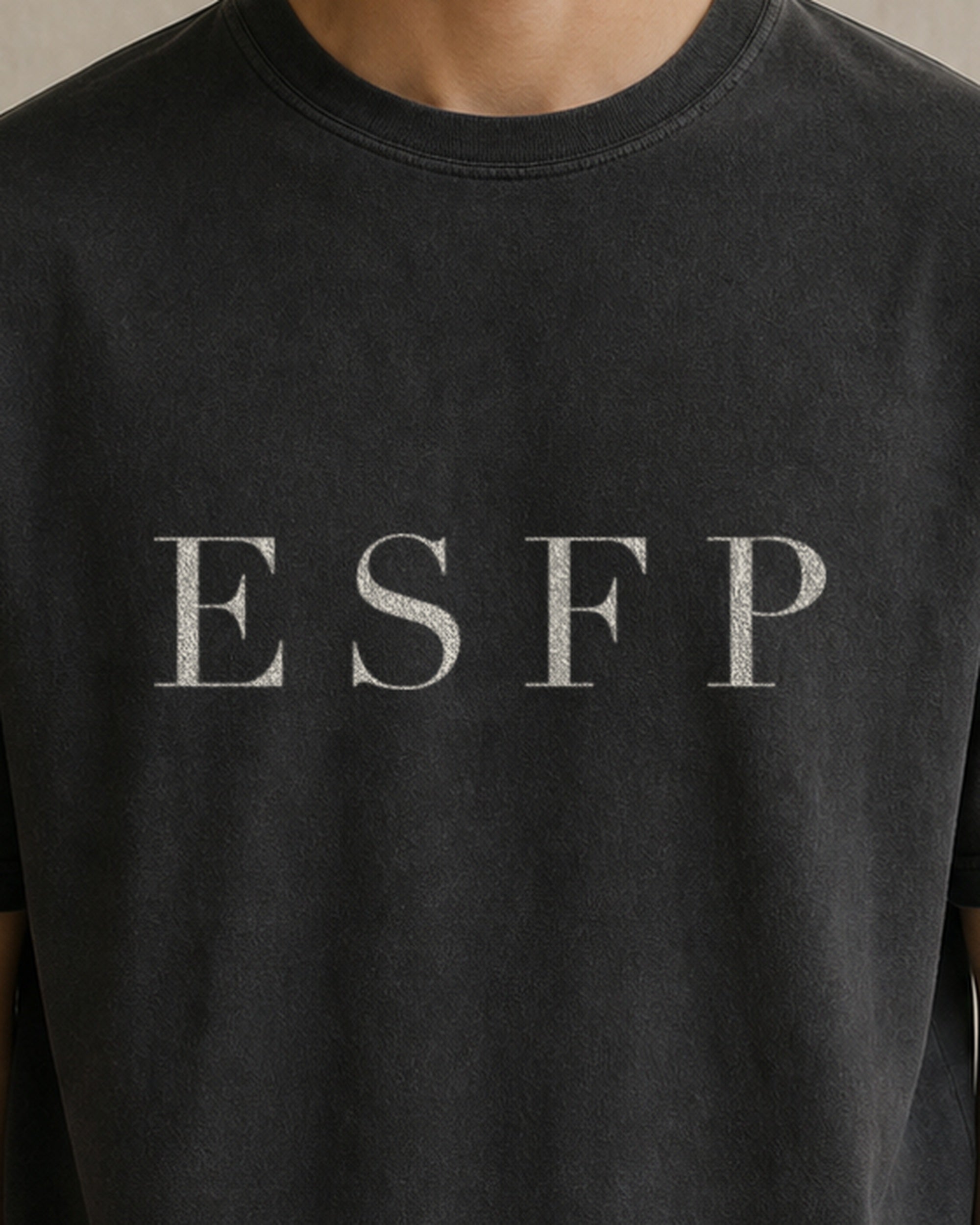 The Typese ESFP Comfort Colors Tee in black, male front detail