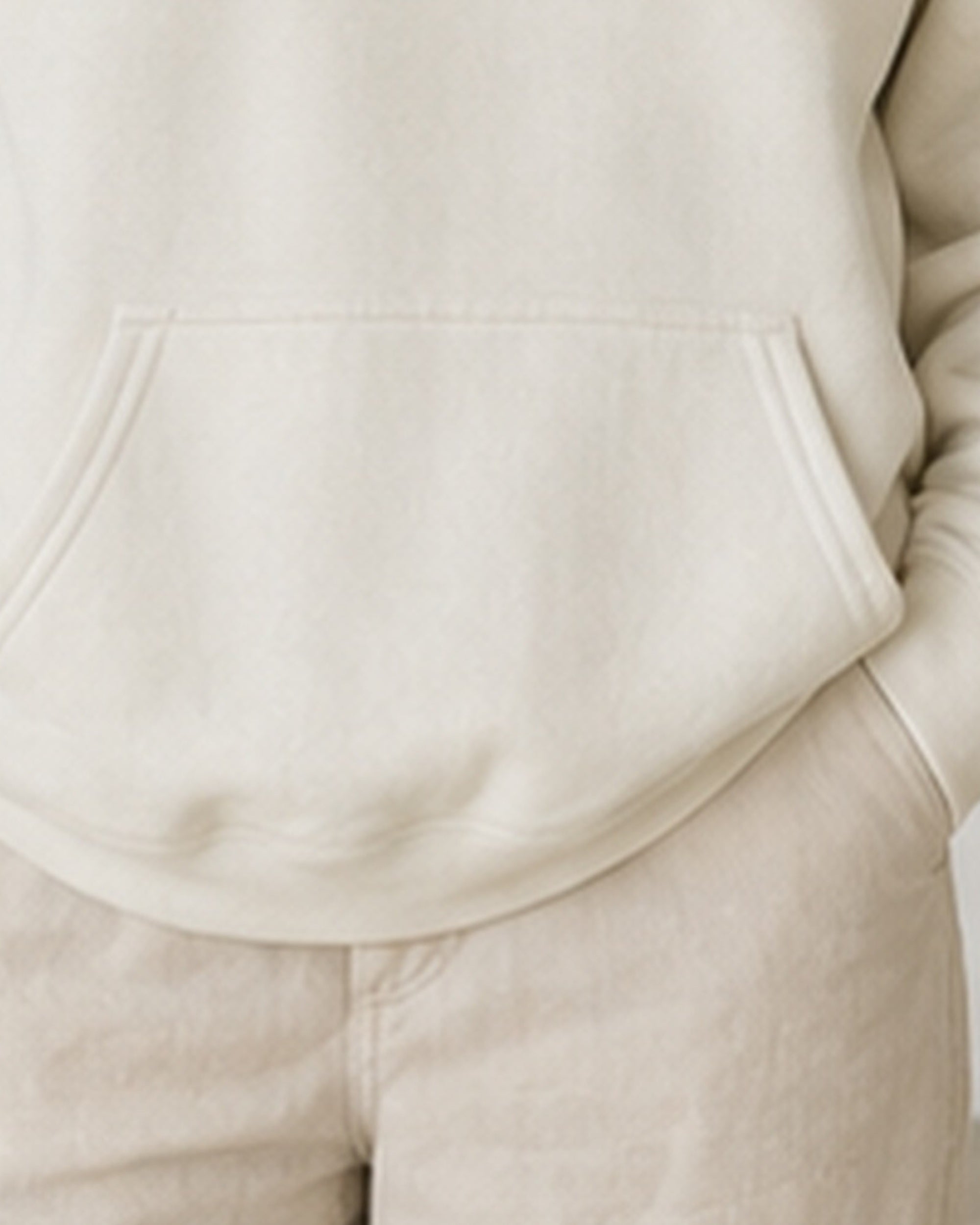 The Typese ESFP Gildan hoodie in white, hem pocket detail