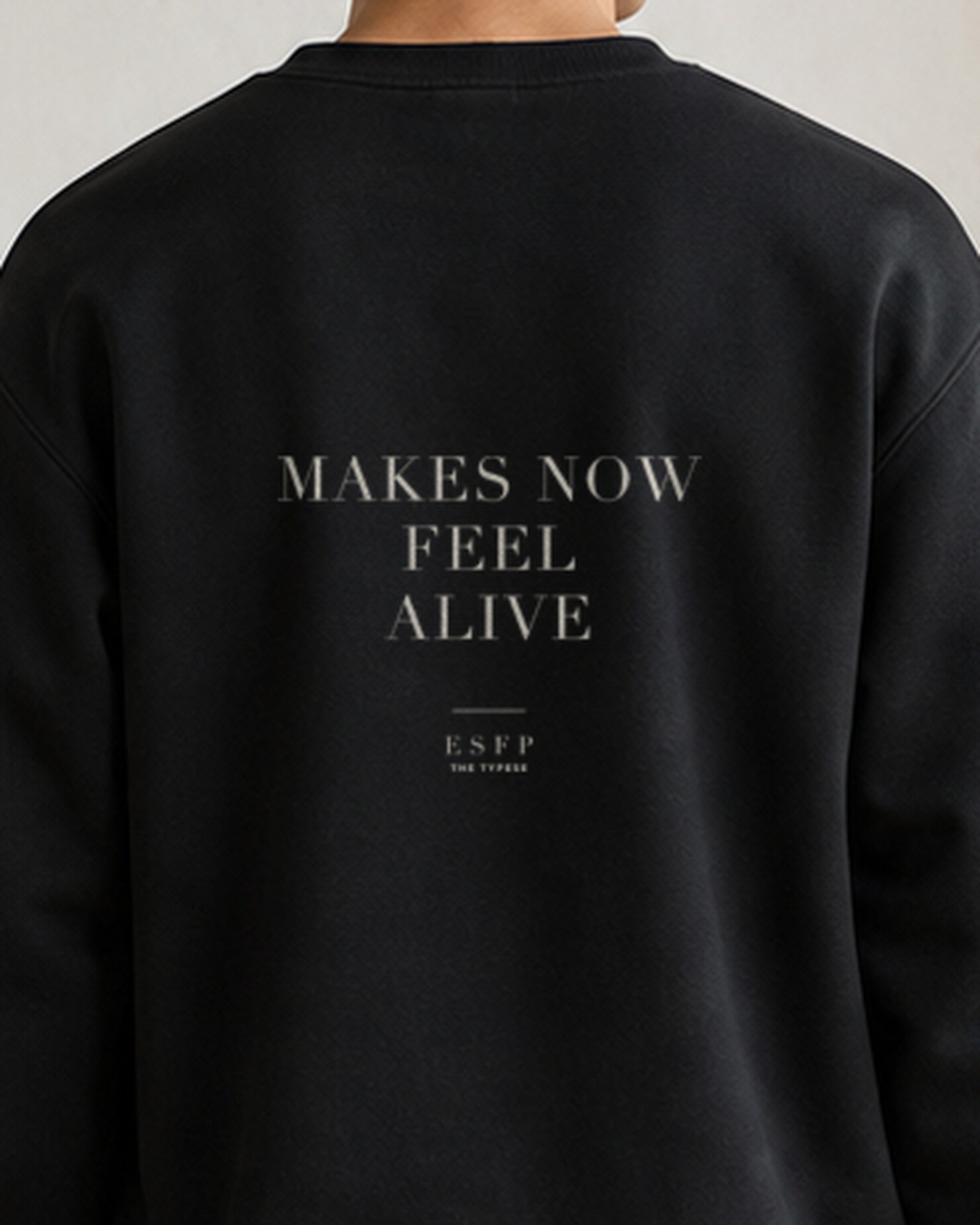 The Typese ESFP Gildan crewneck sweatshirt in black, male back detail