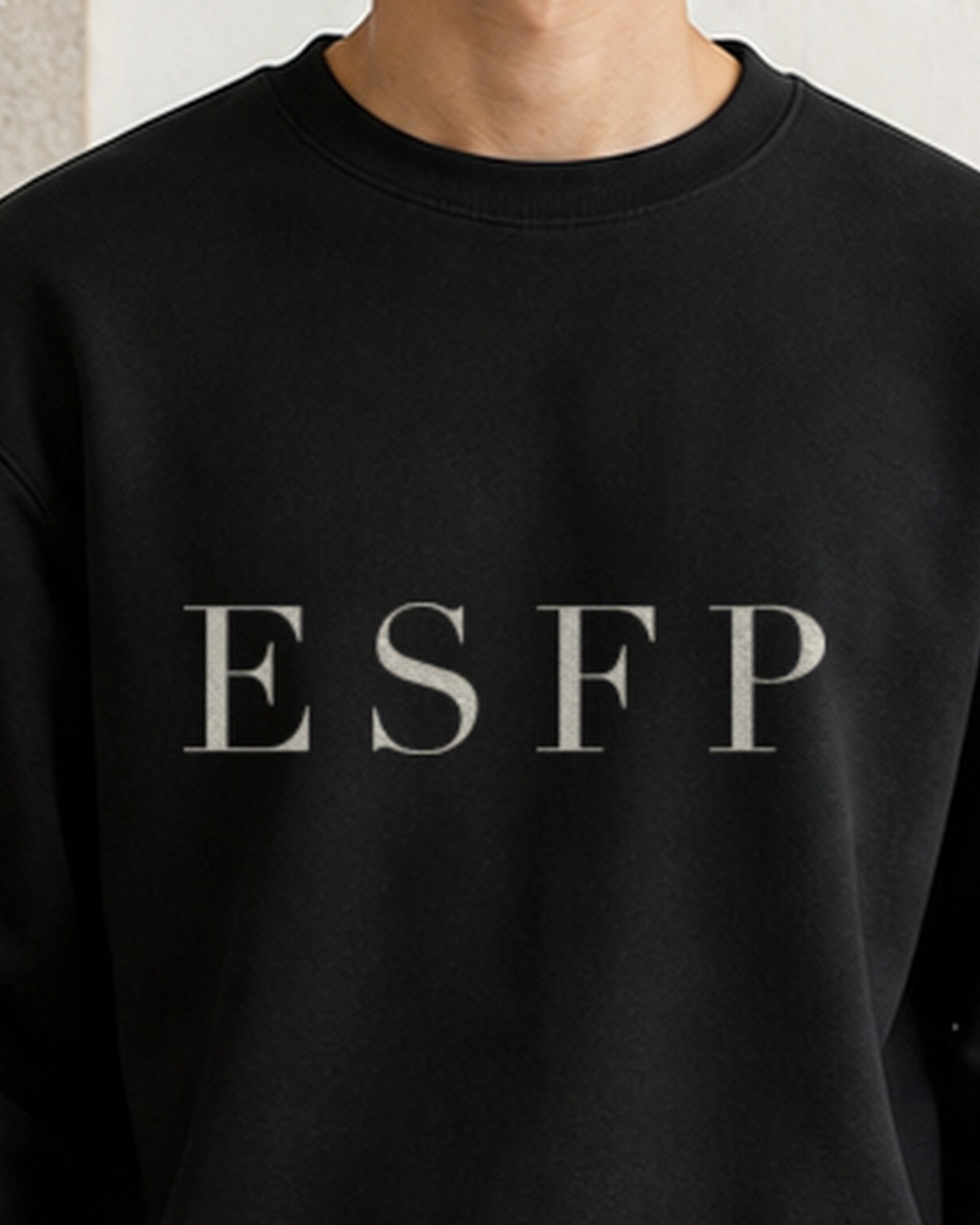 The Typese ESFP Gildan crewneck sweatshirt in black, male front neckline fabric