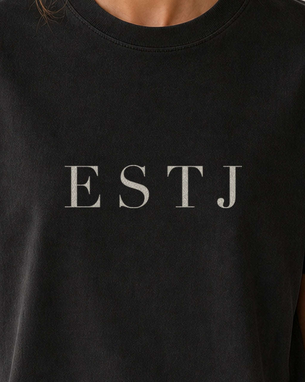 The Typese ESTJ Comfort Colors Tee in black, female front detail