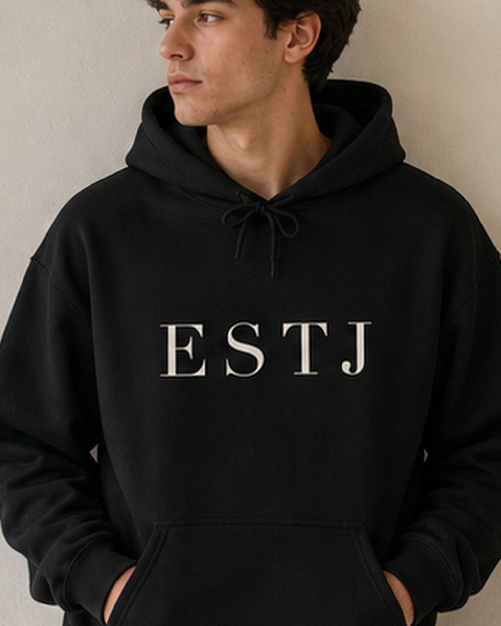 The Typese ESTJ Gildan hoodie in black, male front detail