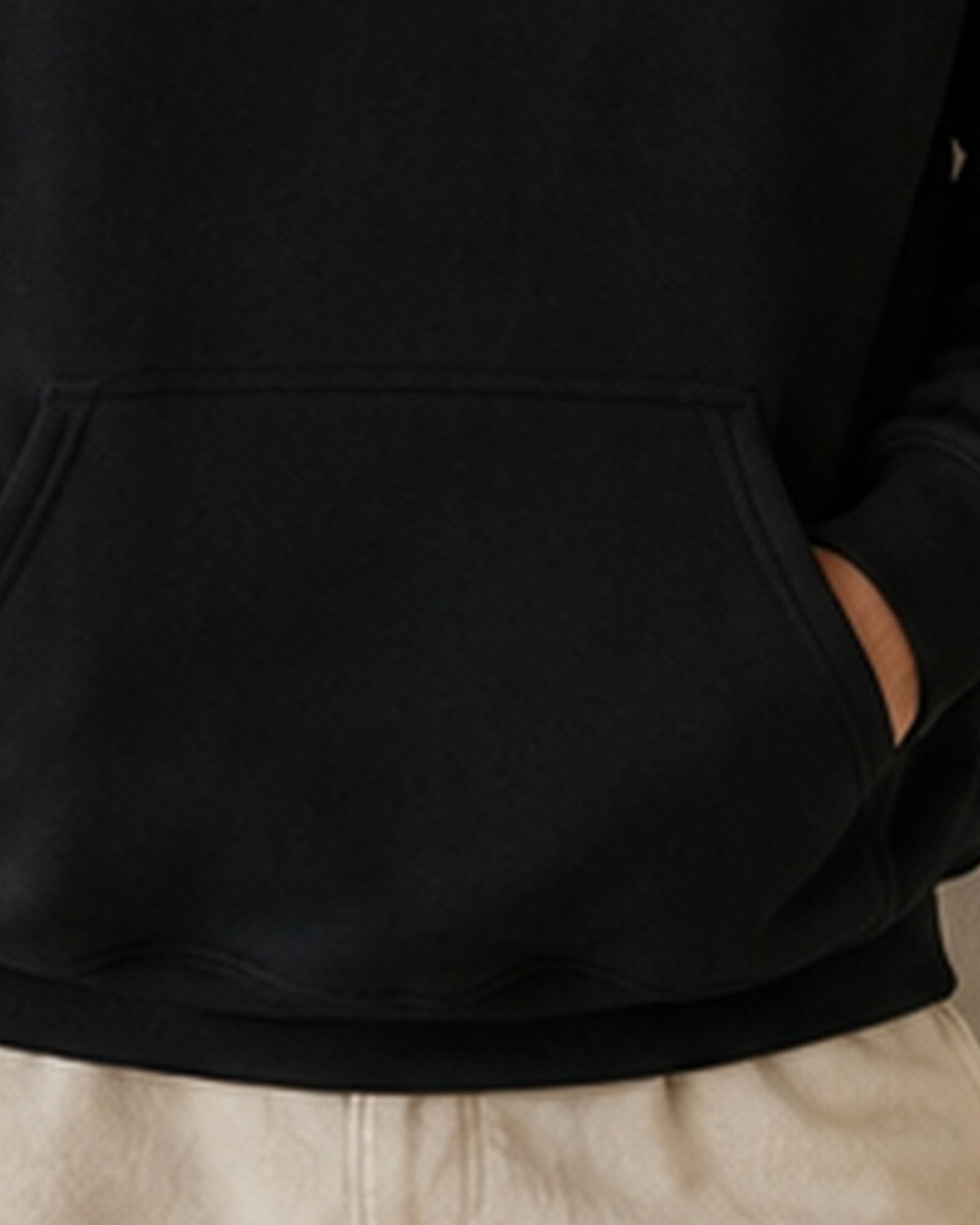 The Typese ESTJ Gildan hoodie in black, hem pocket detail