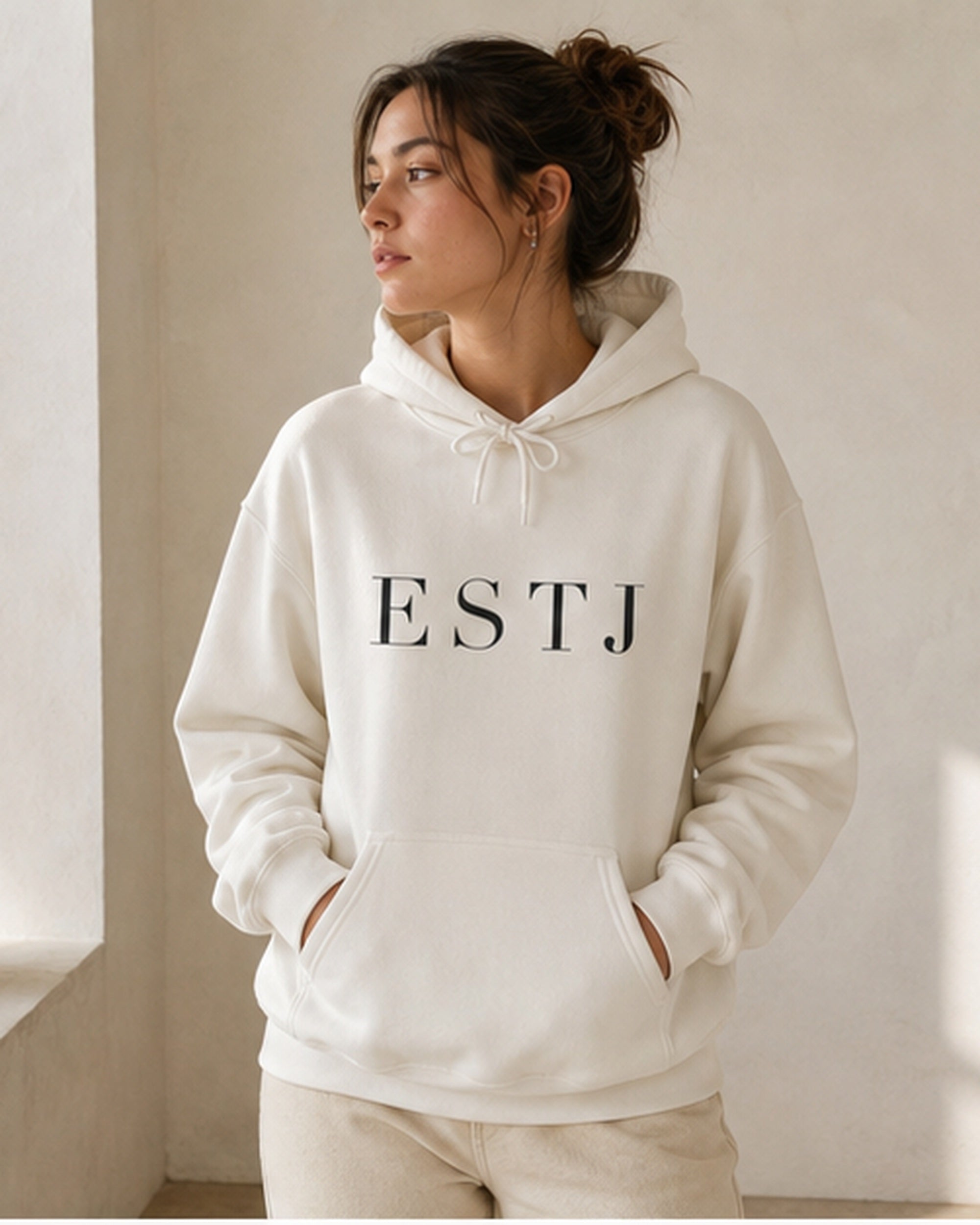 The Typese ESTJ Gildan hoodie in white, female front