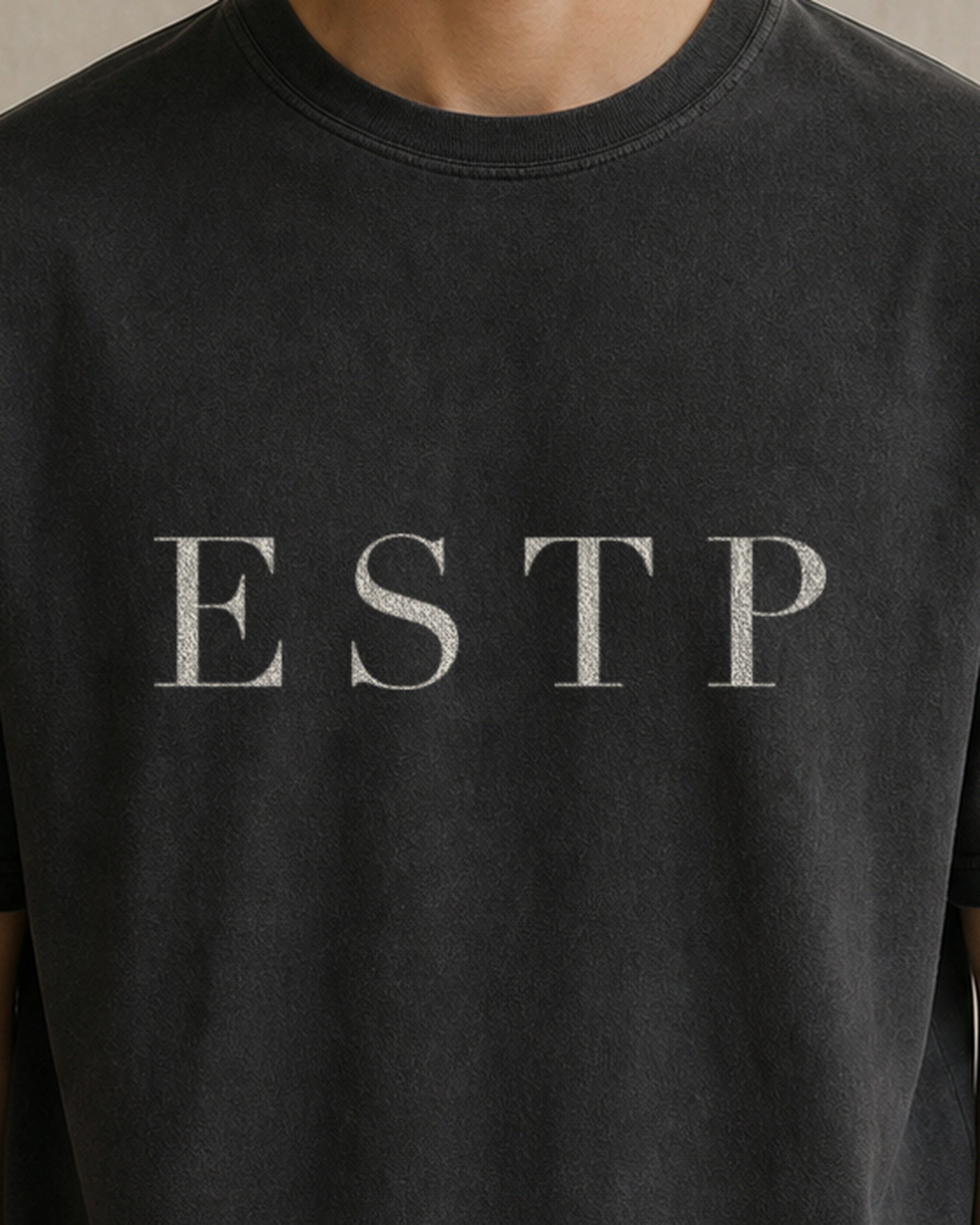 The Typese ESTP Comfort Colors Tee in black, male front detail
