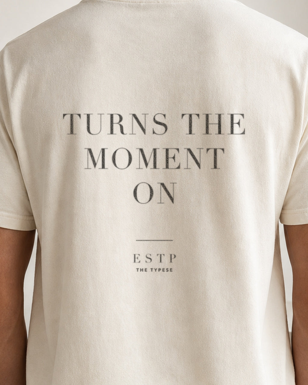 The Typese ESTP Comfort Colors Tee in cream white, male back detail