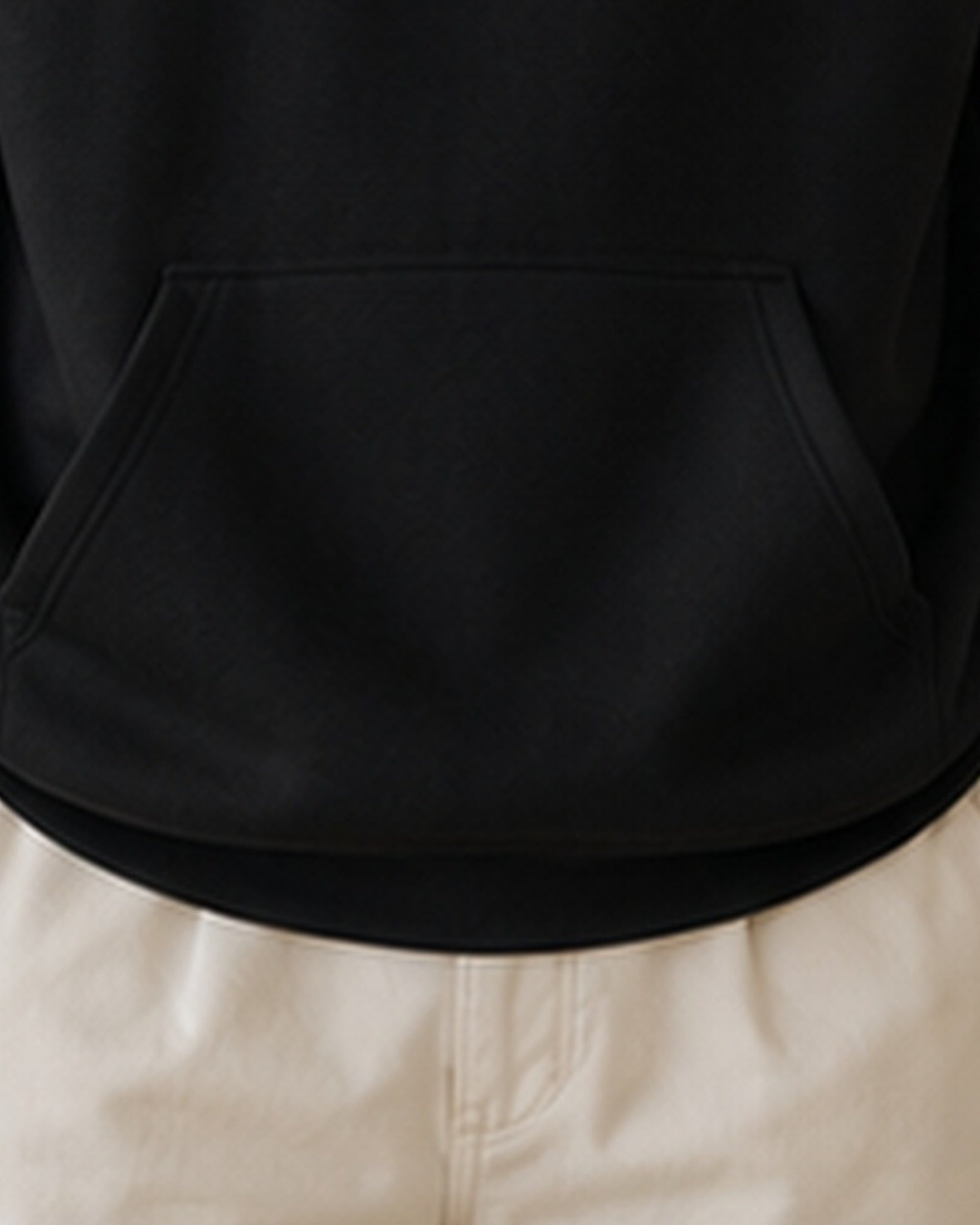 The Typese ESTP Gildan hoodie in black, hem pocket detail