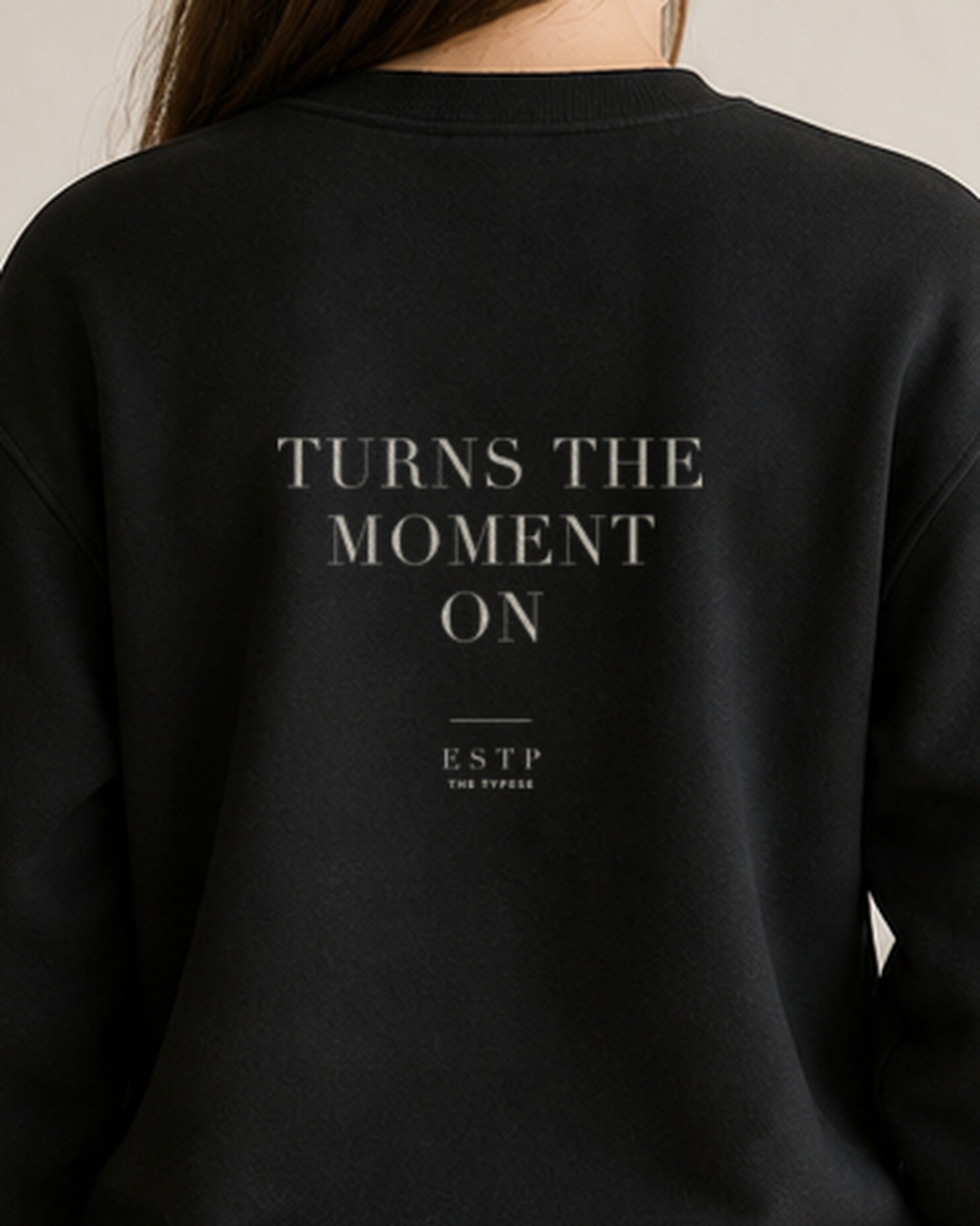 The Typese ESTP Gildan crewneck sweatshirt in black, female back detail
