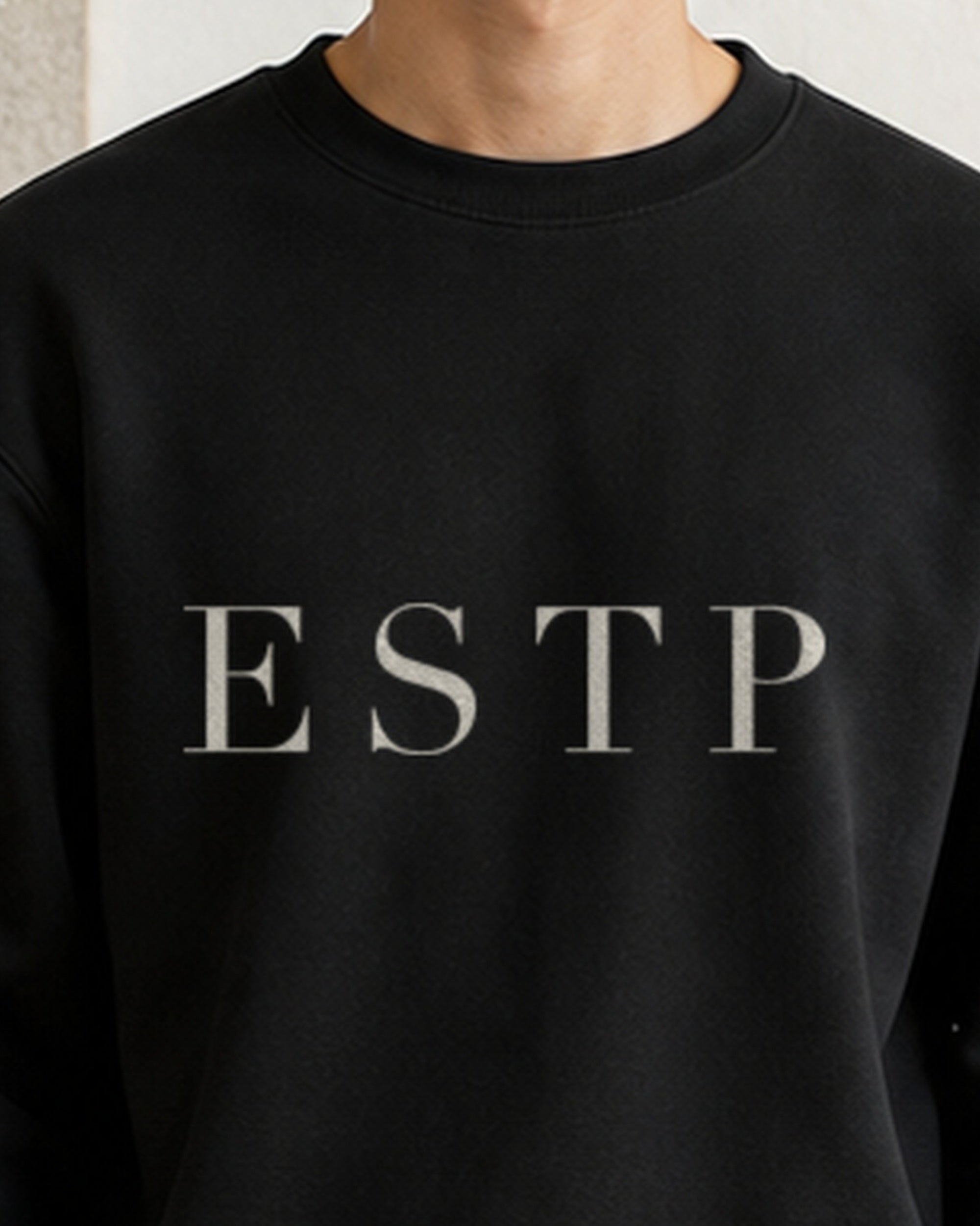 The Typese ESTP Gildan crewneck sweatshirt in black, male front neckline fabric