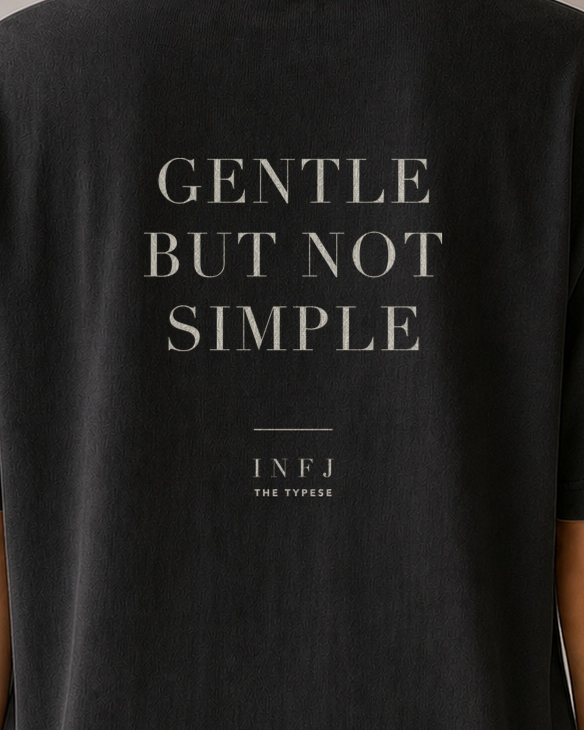 The Typese INFJ Comfort Colors Tee in black, female back detail