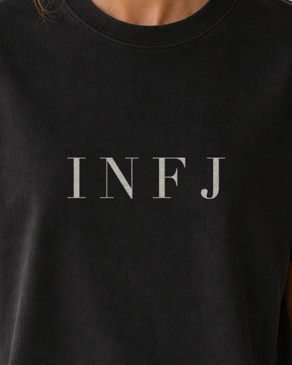The Typese INFJ Comfort Colors Tee in black, female front detail