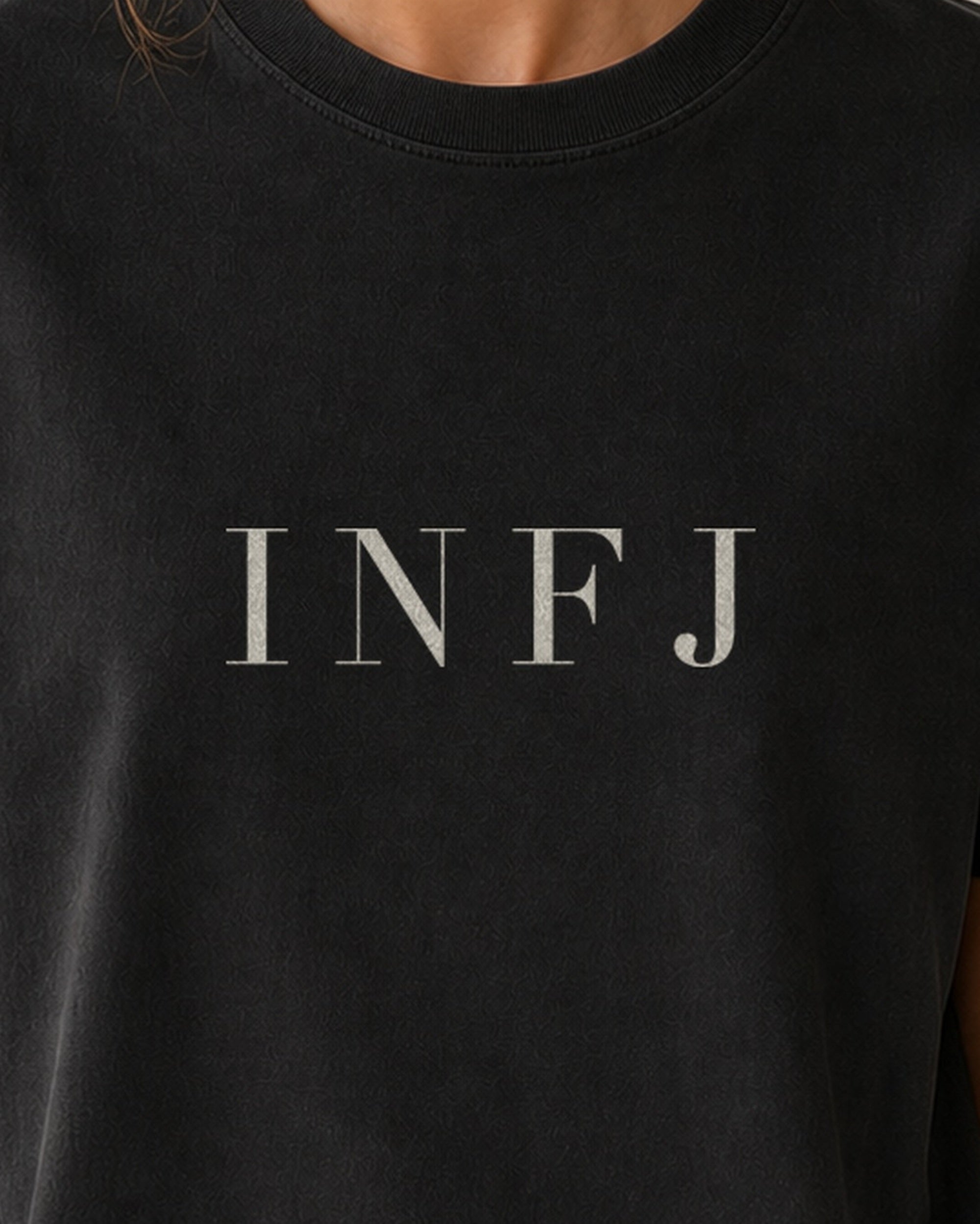 The Typese INFJ Comfort Colors Tee in black, female front detail