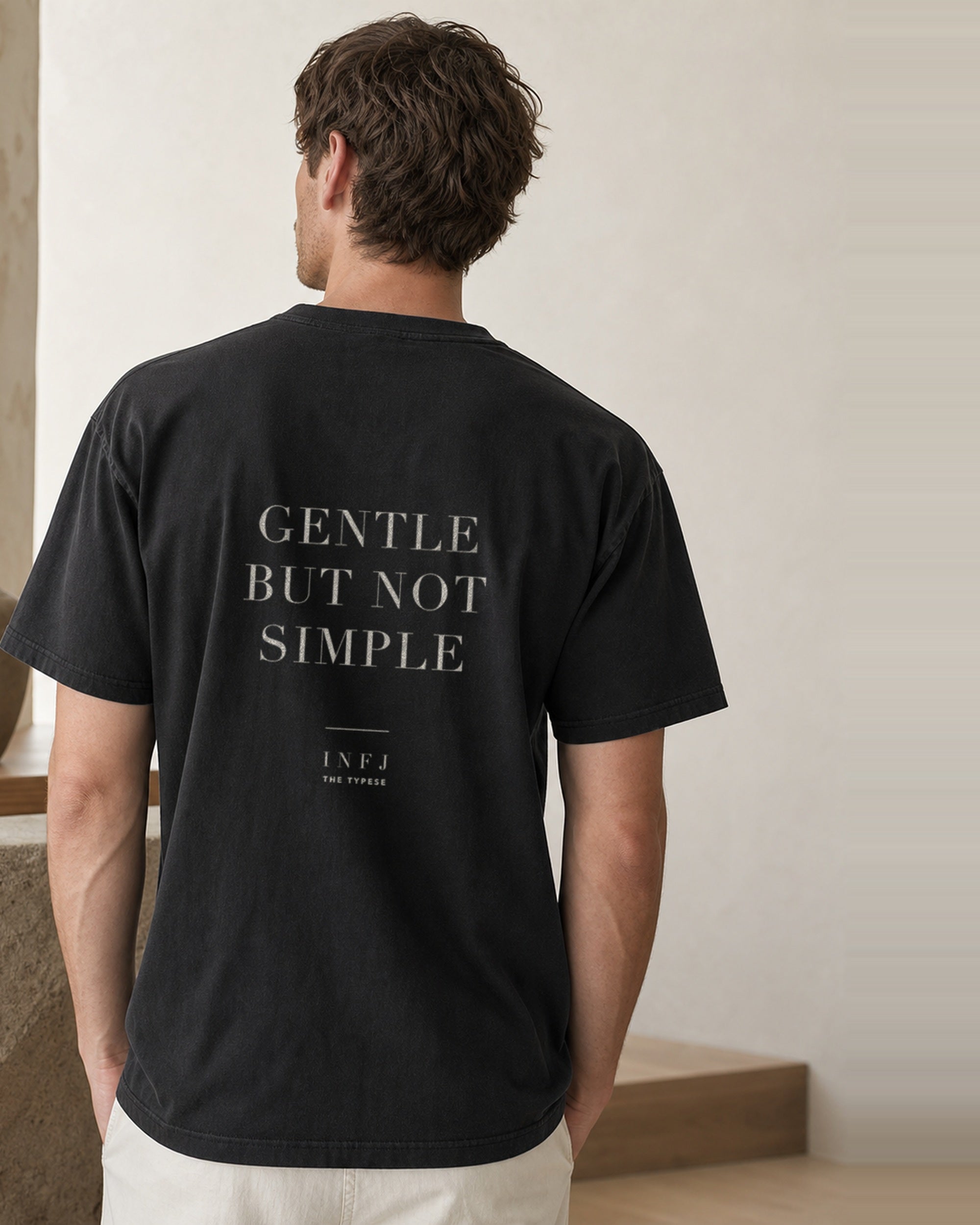 The Typese INFJ Comfort Colors Tee in black, male back