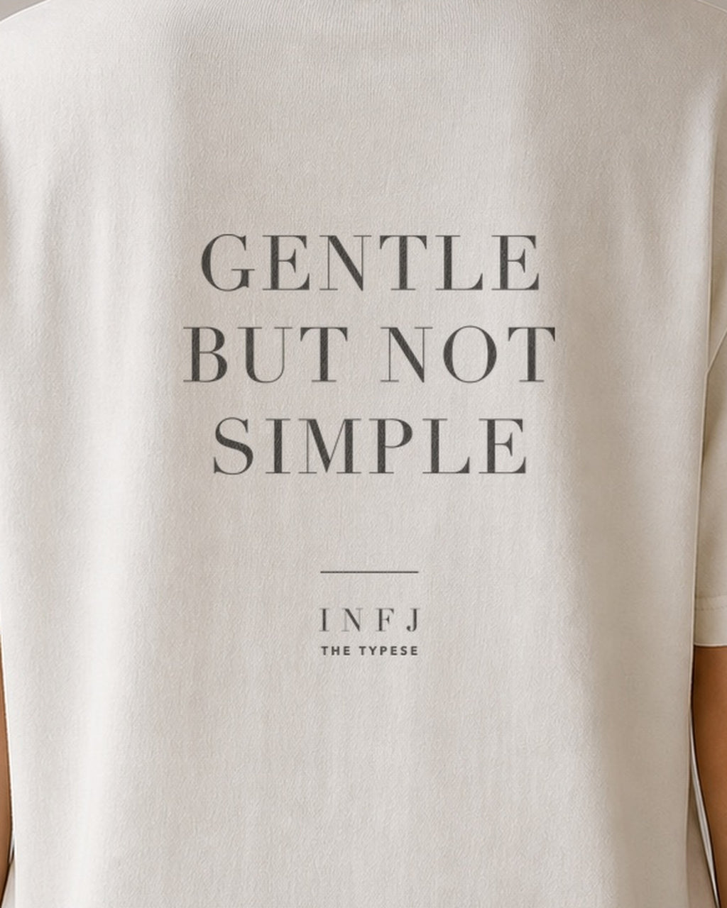 The Typese INFJ Comfort Colors Tee in cream white, female back detail